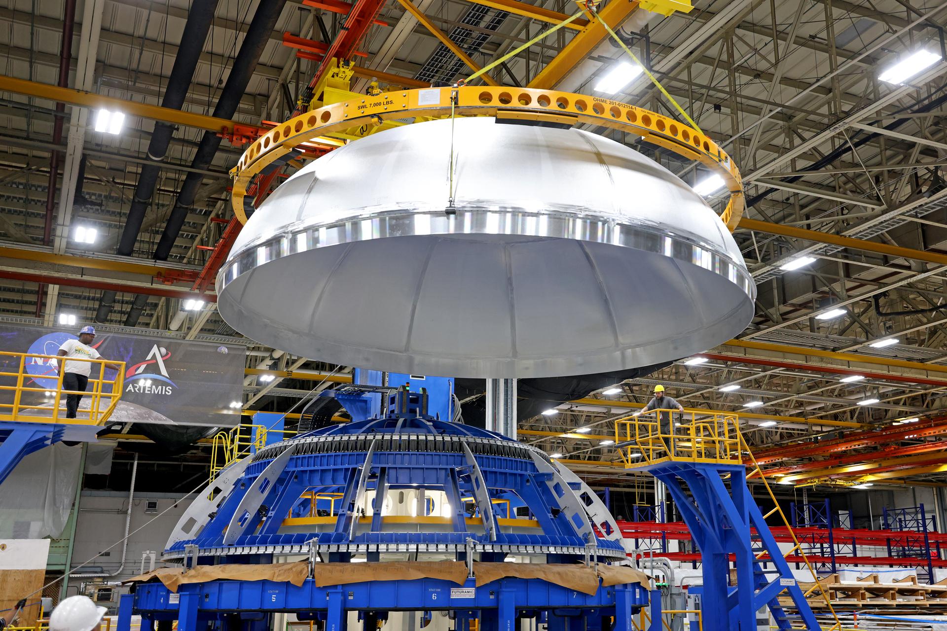 Teams completed welding of the liquid oxygen dome for the core stage of a future SLS (Space Launch System) rocket at NASA’s Michoud Assembly Facility in New Orleans. The dome, which will cap off the forward end of the liquid oxygen tank, was lifted off of the robotic weld tool and moved to an assembly area for the next phase of production. Later, crews will add the forward dome to join the two barrels and the aft dome to complete the liquid oxygen tank. The flight hardware will be used for Artemis IV, the first flight of SLS in its Block 1B configuration. The SLS core stage liquid oxygen tank holds 196,000 gallons of super-cooled liquid propellant. The SLS core stage is made up of five unique elements: the forward skirt, liquid oxygen tank, intertank, liquid hydrogen tank, and the engine section. The liquid oxygen and the liquid hydrogen tanks will provide propellant to the four RS-25 engines to produce more than two million pounds of thrust to help launch NASA’s Orion spacecraft, astronauts, and supplies beyond Earth’s orbit to the Moon. Image credit: NASA/Michael DeMocker