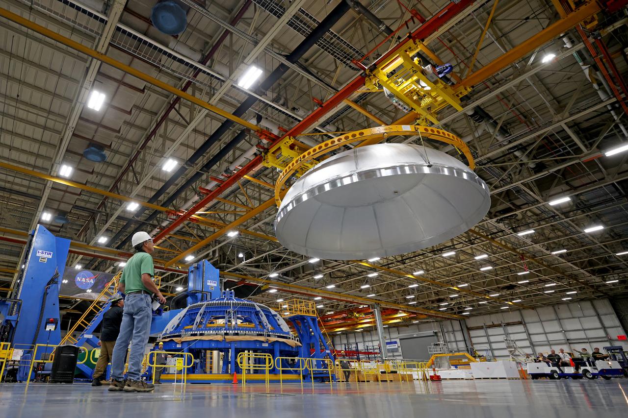 Teams completed welding of the liquid oxygen dome for the core stage of a future SLS (Space Launch System) rocket at NASA’s Michoud Assembly Facility in New Orleans. The dome, which will cap off the forward end of the liquid oxygen tank, was lifted off of the robotic weld tool and moved to an assembly area for the next phase of production. Later, crews will add the forward dome to join the two barrels and the aft dome to complete the liquid oxygen tank. The flight hardware will be used for Artemis IV, the first flight of SLS in its Block 1B configuration.  The SLS core stage liquid oxygen tank holds 196,000 gallons of super-cooled liquid propellant. The SLS core stage is made up of five unique elements: the forward skirt, liquid oxygen tank, intertank, liquid hydrogen tank, and the engine section. The liquid oxygen and the liquid hydrogen tanks will provide propellant to the four RS-25 engines to produce more than two million pounds of thrust to help launch NASA’s Orion spacecraft, astronauts, and supplies beyond Earth’s orbit to the Moon. Image credit: NASA/Michael DeMocker