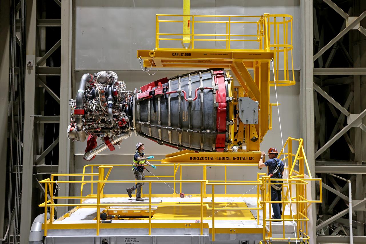 Technicians at NASA’s Michoud Assembly Facility in New Orleans have installed the first of four RS-25 engines on the core stage of the agency’s SLS (Space Launch System) rocket that will help power NASA’s first crewed Artemis mission to the Moon.   The Sept. 11 engine installation follows the joining of all five major structures that make up the SLS core stage earlier this spring. NASA, lead RS-25 engines contractor Aerojet Rocketdyne, an L3 Harris Technologies company, and Boeing, the core stage lead contractor, will continue integrating the remaining three engines into the stage and installing the propulsion and electrical systems within the structure. All four RS-25 engines are located at the base of the core stage within the engine section.  NASA is working to land the first woman and first person of color on the Moon under Artemis. SLS is part of NASA’s backbone for deep space exploration, along with Orion and the Gateway in orbit around the Moon. SLS is the only rocket that can send Orion, astronauts, and supplies to the Moon in a single mission. 