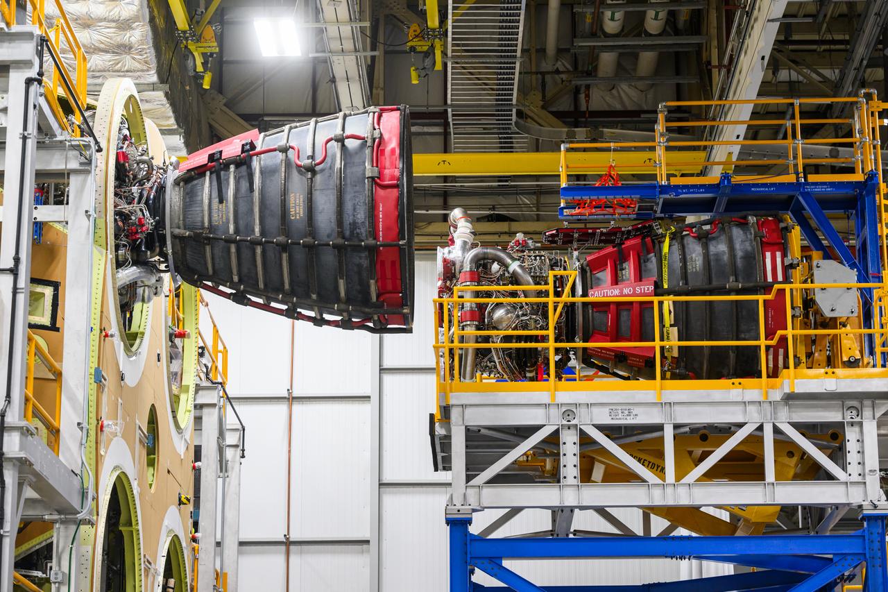 These photos and videos show how technicians at NASA’s Michoud Assembly Facility in New Orleans installed the second of four RS-25 engines onto the core stage for the agency’s SLS (Space Launch System) rocket that will help power NASA’s first crewed Artemis mission to the Moon.   Crews added the second engine, with the serial number E2047 in position one, to the stage Sept. 15. The serial number for the engine installed Sept. 11 in position two on the core stage is E2059. Engineers consider the engines to be “soft” mated to the rocket stage. Following soft mate of all four engines, technicians with NASA, Aerojet Rocketdyne, an L3Harris Technologies company and the RS-25 engines lead contractor, along with Boeing, the core stage lead contractor, will fully secure the engines to the stage and integrate the propulsion and electrical systems within the structure. All four RS-25 engines are located at the base of the core stage within the engine section.  NASA is working to land the first woman and first person of color on the Moon under Artemis. SLS is part of NASA’s backbone for deep space exploration, along with Orion and the Gateway in orbit around the Moon. SLS is the only rocket that can send Orion, astronauts, and supplies to the Moon in a single mission. 