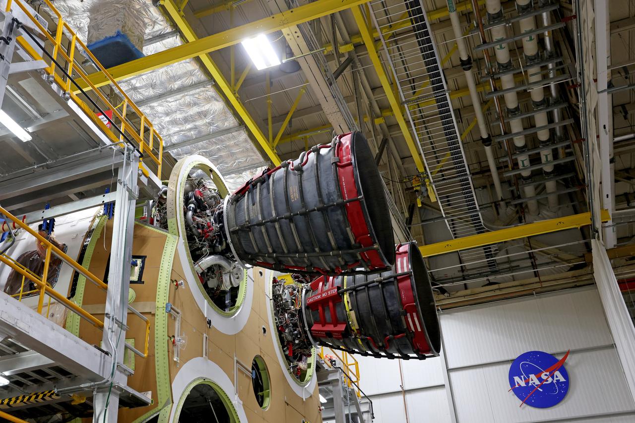 These photos and videos show how technicians at NASA’s Michoud Assembly Facility in New Orleans installed the second of four RS-25 engines onto the core stage for the agency’s SLS (Space Launch System) rocket that will help power NASA’s first crewed Artemis mission to the Moon.   Crews added the second engine, with the serial number E2047 in position one, to the stage Sept. 15. The serial number for the engine installed Sept. 11 in position two on the core stage is E2059. Engineers consider the engines to be “soft” mated to the rocket stage. Following soft mate of all four engines, technicians with NASA, Aerojet Rocketdyne, an L3Harris Technologies company and the RS-25 engines lead contractor, along with Boeing, the core stage lead contractor, will fully secure the engines to the stage and integrate the propulsion and electrical systems within the structure. All four RS-25 engines are located at the base of the core stage within the engine section.  NASA is working to land the first woman and first person of color on the Moon under Artemis. SLS is part of NASA’s backbone for deep space exploration, along with Orion and the Gateway in orbit around the Moon. SLS is the only rocket that can send Orion, astronauts, and supplies to the Moon in a single mission. 