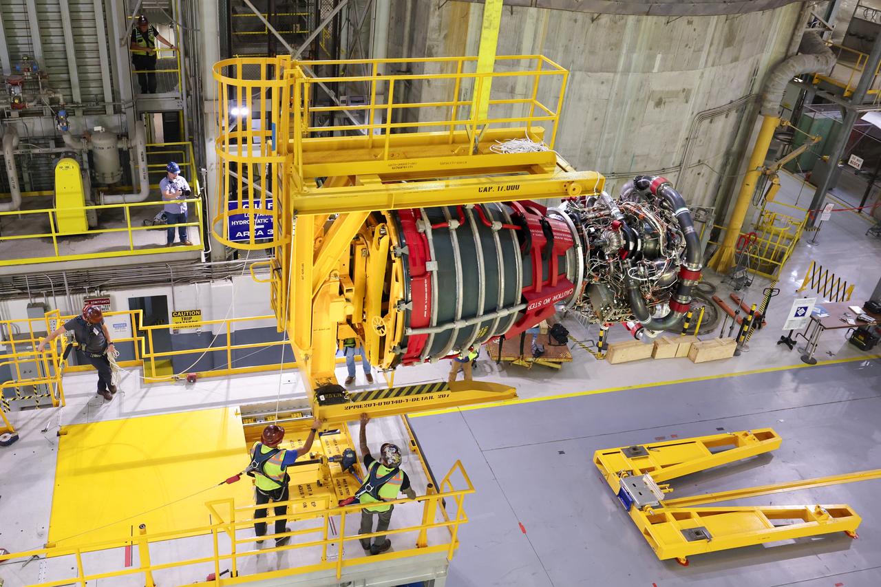 These photos and videos show how technicians at NASA’s Michoud Assembly Facility in New Orleans installed the third and fourth RS-25 engines onto the core stage for the agency’s SLS (Space Launch System) rocket that will help power NASA’s first crewed Artemis mission to the Moon.   Technicians added the first engine to the SLS core stage Sept. 11. The second engine was installed onto the stage Sept. 15 with the third and fourth engines following Sept. 19 and Sept. 20. Engineers consider the engines to be “soft” mated to the rocket stage. Technicians with NASA, Aerojet Rocketdyne, an L3Harris Technologies company and the RS-25 engines lead contractor, along with Boeing, the core stage lead contractor, will now focus efforts on the complex tax of fully securing the engines to the stage and integrating the propulsion and electrical systems within the structure.  NASA is working to land the first woman and first person of color on the Moon under Artemis. SLS is part of NASA’s backbone for deep space exploration, along with Orion and the Gateway in orbit around the Moon. SLS is the only rocket that can send Orion, astronauts, and supplies to the Moon in a single mission. 