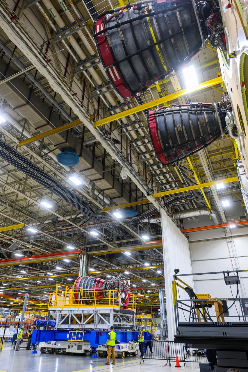 These photos and videos show how technicians at NASA’s Michoud Assembly Facility in New Orleans installed the third and fourth RS-25 engines onto the core stage for the agency’s SLS (Space Launch System) rocket that will help power NASA’s first crewed Artemis mission to the Moon.   Technicians added the first engine to the SLS core stage Sept. 11. The second engine was installed onto the stage Sept. 15 with the third and fourth engines following Sept. 19 and Sept. 20. Engineers consider the engines to be “soft” mated to the rocket stage. Technicians with NASA, Aerojet Rocketdyne, an L3Harris Technologies company and the RS-25 engines lead contractor, along with Boeing, the core stage lead contractor, will now focus efforts on the complex tax of fully securing the engines to the stage and integrating the propulsion and electrical systems within the structure.  NASA is working to land the first woman and first person of color on the Moon under Artemis. SLS is part of NASA’s backbone for deep space exploration, along with Orion and the Gateway in orbit around the Moon. SLS is the only rocket that can send Orion, astronauts, and supplies to the Moon in a single mission.