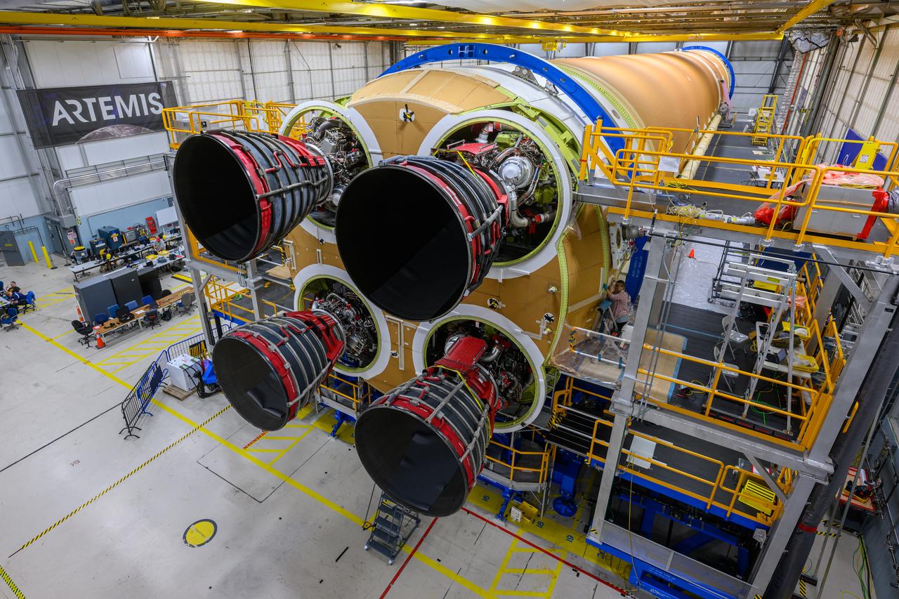 These photos and videos show how technicians at NASA’s Michoud Assembly Facility in New Orleans installed the third and fourth RS-25 engines onto the core stage for the agency’s SLS (Space Launch System) rocket that will help power NASA’s first crewed Artemis mission to the Moon.   Technicians added the first engine to the SLS core stage Sept. 11. The second engine was installed onto the stage Sept. 15 with the third and fourth engines following Sept. 19 and Sept. 20. Engineers consider the engines to be “soft” mated to the rocket stage. Technicians with NASA, Aerojet Rocketdyne, an L3Harris Technologies company and the RS-25 engines lead contractor, along with Boeing, the core stage lead contractor, will now focus efforts on the complex tax of fully securing the engines to the stage and integrating the propulsion and electrical systems within the structure.   NASA is working to land the first woman and first person of color on the Moon under Artemis. SLS is part of NASA’s backbone for deep space exploration, along with Orion and the Gateway in orbit around the Moon. SLS is the only rocket that can send Orion, astronauts, and supplies to the Moon in a single mission.