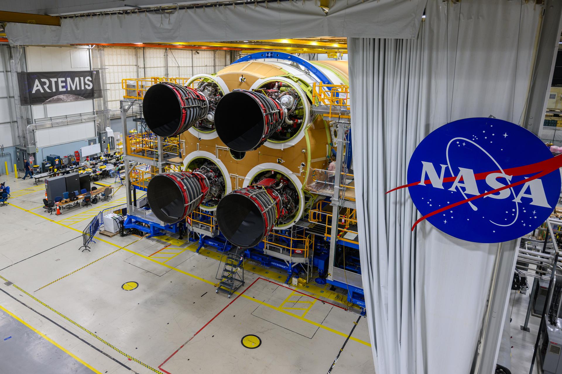 These photos and videos show how technicians at NASA’s Michoud Assembly Facility in New Orleans installed the third and fourth RS-25 engines onto the core stage for the agency’s SLS (Space Launch System) rocket that will help power NASA’s first crewed Artemis mission to the Moon.   Technicians added the first engine to the SLS core stage Sept. 11. The second engine was installed onto the stage Sept. 15 with the third and fourth engines following Sept. 19 and Sept. 20. Engineers consider the engines to be “soft” mated to the rocket stage. Technicians with NASA, Aerojet Rocketdyne, an L3Harris Technologies company and the RS-25 engines lead contractor, along with Boeing, the core stage lead contractor, will now focus efforts on the complex tax of fully securing the engines to the stage and integrating the propulsion and electrical systems within the structure.   NASA is working to land the first woman and first person of color on the Moon under Artemis. SLS is part of NASA’s backbone for deep space exploration, along with Orion and the Gateway in orbit around the Moon. SLS is the only rocket that can send Orion, astronauts, and supplies to the Moon in a single mission.