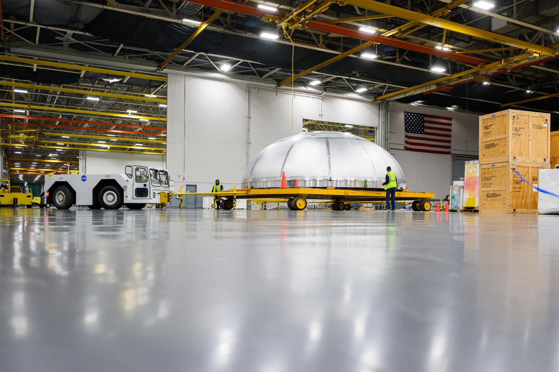 This imagery shows how technicians at NASA’s Michoud Assembly Facility moved the aft dome of the liquid oxygen tank for NASA’s SLS (Space Launch System) rocket for the next phase of production inside the Vertical Assembly center Dec. 5. The dome will form part of the core stage that will power NASA’s Artemis III mission. Engineers will soon rotate the dome to attach it to the previously joined forward dome and aft barrel segments using friction-stir welding.  The liquid oxygen tank is one of five major components that make up the SLS rocket’s core stage. Together with the forward skirt, intertank, liquid hydrogen tank, engine section, along with the four RS-25 engines at its base, the 212-foot core stage will help power NASA’s Artemis missions to the Moon.