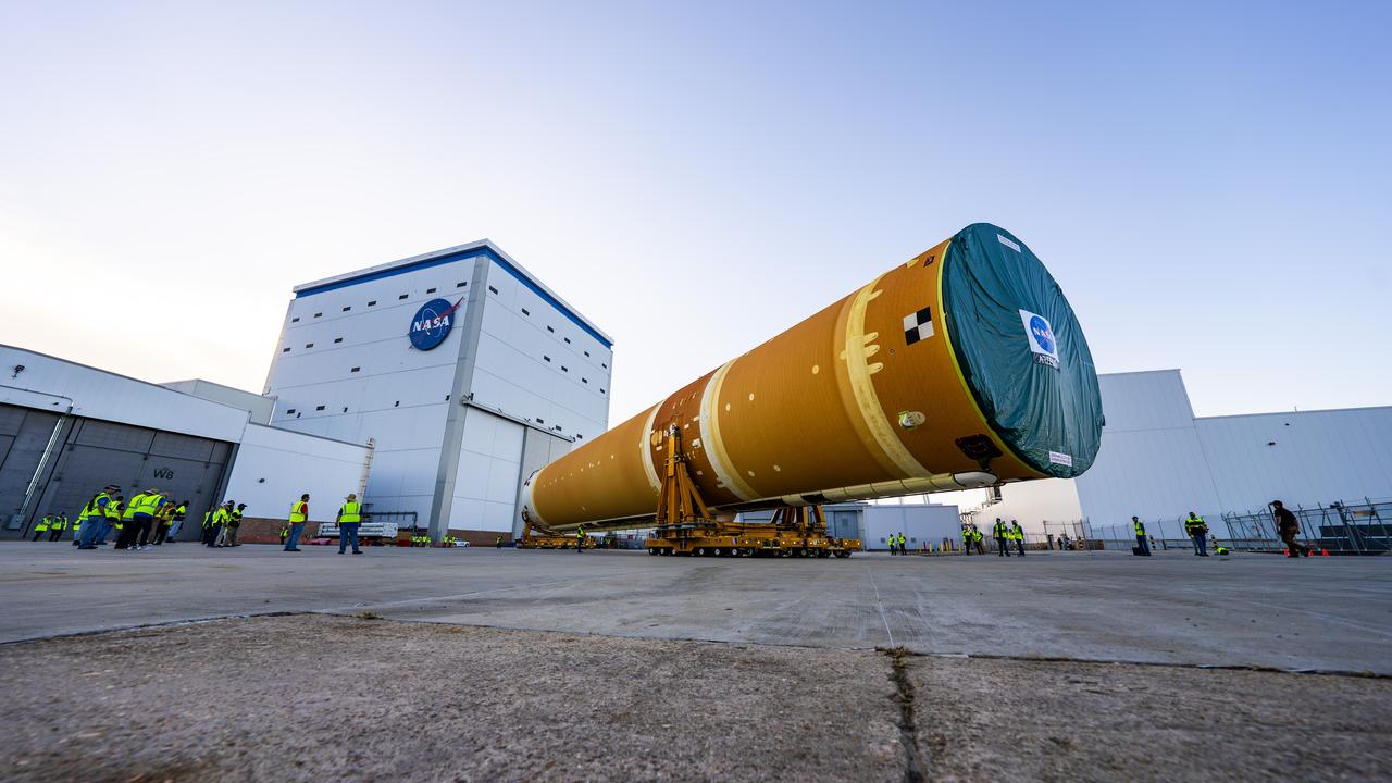 These images and videos show team members moving the first core stage that will help launch the first crewed flight of NASA’s SLS (Space Launch System) rocket for the agency’s Artemis II mission. The move marked the first time a fully assembled Moon rocket stage for a crewed mission has rolled out from NASA’s Michoud Assembly Facility in New Orleans since the Apollo Program, The core stage was moved onto the agency’s Pegasus barge, where it will be ferried to NASA’s Kennedy Space Center in Florida.  The core stage for the SLS mega rocket is the largest stage NASA has ever produced. At 212 feet tall, the stage consists of five major elements, including two huge propellant tanks that collectively hold more than 733,000 gallons of super chilled liquid propellant to feed four RS-25 engines at its base. During launch and flight, the stage will operate for just over eight minutes, producing more than 2 million pounds of thrust to help send a crew of four astronauts inside NASA’s Orion spacecraft onward to the Moon.  NASA is working to land the first woman, first person of color, and its first international partner astronaut on the Moon under Artemis. SLS is part of NASA’s backbone for deep space exploration, along with the Orion spacecraft and Gateway in orbit around the Moon and commercial human landing systems, next-generation space, next-generational spacesuits, and rovers on the lunar surface. SLS is the only rocket that can send Orion, astronauts, and supplies to the Moon in a single launch. 