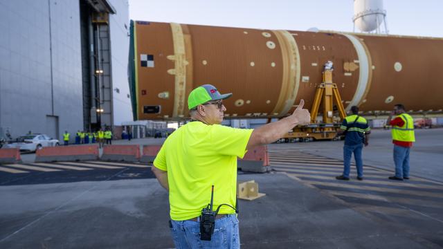 NASA image: Core Stage for Artemis II Rocket Moved to Pegasus Barge for Departure to Kennedy Space Center