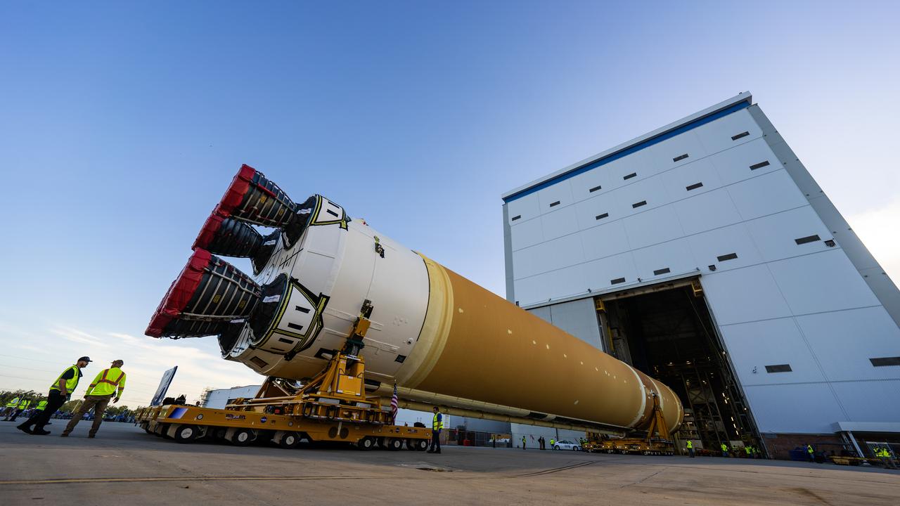 These images and videos show team members moving the first core stage that will help launch the first crewed flight of NASA’s SLS (Space Launch System) rocket for the agency’s Artemis II mission. The move marked the first time a fully assembled Moon rocket stage for a crewed mission has rolled out from NASA’s Michoud Assembly Facility in New Orleans since the Apollo Program, The core stage was moved onto the agency’s Pegasus barge, where it will be ferried to NASA’s Kennedy Space Center in Florida.  The core stage for the SLS mega rocket is the largest stage NASA has ever produced. At 212 feet tall, the stage consists of five major elements, including two huge propellant tanks that collectively hold more than 733,000 gallons of super chilled liquid propellant to feed four RS-25 engines at its base. During launch and flight, the stage will operate for just over eight minutes, producing more than 2 million pounds of thrust to help send a crew of four astronauts inside NASA’s Orion spacecraft onward to the Moon.  NASA is working to land the first woman, first person of color, and its first international partner astronaut on the Moon under Artemis. SLS is part of NASA’s backbone for deep space exploration, along with the Orion spacecraft and Gateway in orbit around the Moon and commercial human landing systems, next-generation space, next-generational spacesuits, and rovers on the lunar surface. SLS is the only rocket that can send Orion, astronauts, and supplies to the Moon in a single launch. 