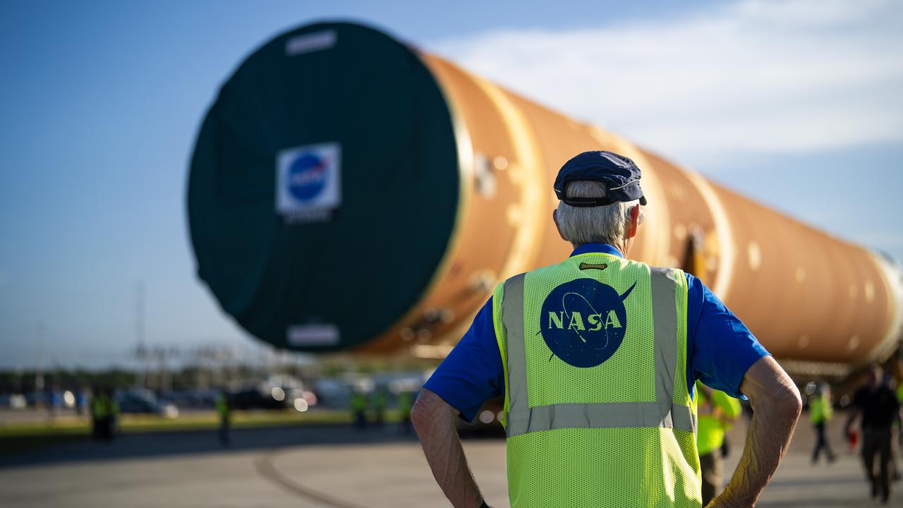 These images and videos show team members moving the first core stage that will help launch the first crewed flight of NASA’s SLS (Space Launch System) rocket for the agency’s Artemis II mission. The move marked the first time a fully assembled Moon rocket stage for a crewed mission has rolled out from NASA’s Michoud Assembly Facility in New Orleans since the Apollo Program, The core stage was moved onto the agency’s Pegasus barge, where it will be ferried to NASA’s Kennedy Space Center in Florida.  The core stage for the SLS mega rocket is the largest stage NASA has ever produced. At 212 feet tall, the stage consists of five major elements, including two huge propellant tanks that collectively hold more than 733,000 gallons of super chilled liquid propellant to feed four RS-25 engines at its base. During launch and flight, the stage will operate for just over eight minutes, producing more than 2 million pounds of thrust to help send a crew of four astronauts inside NASA’s Orion spacecraft onward to the Moon.  NASA is working to land the first woman, first person of color, and its first international partner astronaut on the Moon under Artemis. SLS is part of NASA’s backbone for deep space exploration, along with the Orion spacecraft and Gateway in orbit around the Moon and commercial human landing systems, next-generation space, next-generational spacesuits, and rovers on the lunar surface. SLS is the only rocket that can send Orion, astronauts, and supplies to the Moon in a single launch. 