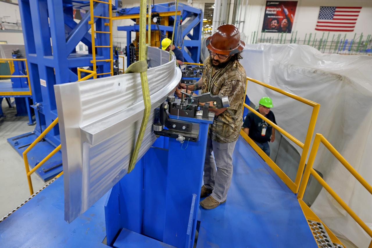 These photos show how teams at NASA’s Michoud Assembly Facility in New Orleans manufactured the Y-ring that will be used on the evolved Block 1B configuration of the SLS (Space Launch System) rocket. It is one of the first components that will make up a portion of the core stage that will power NASA’s Artemis V mission. The large metal ring will serve as the aft ring for the rocket’s liquid hydrogen tank.  The SLS core stage is the backbone of the SLS rocket, stretching 212 feet from top to bottom, and includes four RS-25 engines at its base. At launch, its two huge liquid propellant tanks provide more than 733,000 gallons of fuel to produce more than 2 million pounds of thrust. Michoud Assembly Facility and the SLS Program are managed by NASA’s Marshall Space Flight Center in Huntsville, Alabama. Image credit: NASA/Michael DeMocker