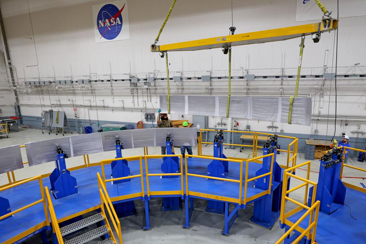 These photos show how teams at NASA’s Michoud Assembly Facility in New Orleans manufactured the Y-ring that will be used on the evolved Block 1B configuration of the SLS (Space Launch System) rocket. It is one of the first components that will make up a portion of the core stage that will power NASA’s Artemis V mission. The large metal ring will serve as the aft ring for the rocket’s liquid hydrogen tank.  The SLS core stage is the backbone of the SLS rocket, stretching 212 feet from top to bottom, and includes four RS-25 engines at its base. At launch, its two huge liquid propellant tanks provide more than 733,000 gallons of fuel to produce more than 2 million pounds of thrust. Michoud Assembly Facility and the SLS Program are managed by NASA’s Marshall Space Flight Center in Huntsville, Alabama. Image credit: NASA/Michael DeMocker