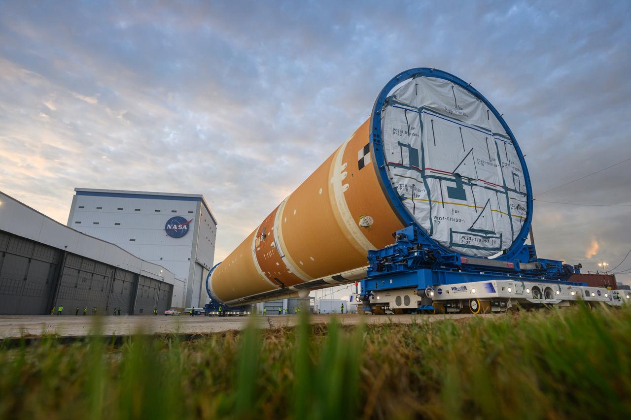 This photo shows NASA and Boeing, the SLS core stage lead contractor, preparing the SLS (Space Launch System) rocket core stage for shipment at NASA’s Michoud Assembly Facility in New Orleans. On July 6, NASA and Boeing moved the Artemis II rocket stage to Building 110. The move comes as teams prepare to roll the massive rocket stage with its four RS-25 engines to the agency’s Pegasus barge for delivery to NASA’s Kennedy Space Center in Florida in mid-July. Prior to the move, technicians began removing external access stands, or scaffolding, surrounding the core stage to assess the interior elements, including its complex avionics and flight propulsion systems. The stage is fully manufactured at NASA Michoud.  NASA is working to land the first woman, first person of color, and its first international partner astronaut on the Moon under Artemis. SLS is part of NASA’s backbone for deep space exploration, along with the Orion spacecraft, supporting ground systems, advanced spacesuits and rovers, the Gateway in orbit around the Moon, and commercial human landing systems. SLS is the only rocket that can send Orion, astronauts, and supplies to the Moon in a single launch.