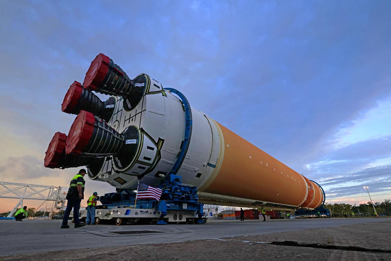 This photo shows NASA and Boeing, the SLS core stage lead contractor, preparing the SLS (Space Launch System) rocket core stage for shipment at NASA’s Michoud Assembly Facility in New Orleans. On July 6, NASA and Boeing moved the Artemis II rocket stage to Building 110. The move comes as teams prepare to roll the massive rocket stage with its four RS-25 engines to the agency’s Pegasus barge for delivery to NASA’s Kennedy Space Center in Florida in mid-July. Prior to the move, technicians began removing external access stands, or scaffolding, surrounding the core stage to assess the interior elements, including its complex avionics and flight propulsion systems. The stage is fully manufactured at NASA Michoud.  NASA is working to land the first woman, first person of color, and its first international partner astronaut on the Moon under Artemis. SLS is part of NASA’s backbone for deep space exploration, along with the Orion spacecraft, supporting ground systems, advanced spacesuits and rovers, the Gateway in orbit around the Moon, and commercial human landing systems. SLS is the only rocket that can send Orion, astronauts, and supplies to the Moon in a single launch.  Image credit: NASA/Michael DeMocker