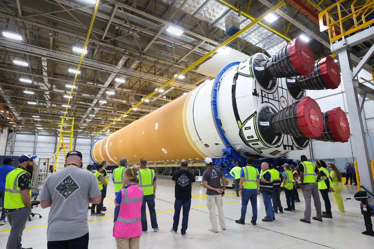 This photo shows NASA and Boeing, the SLS core stage lead contractor, preparing the SLS (Space Launch System) rocket core stage for shipment at NASA’s Michoud Assembly Facility in New Orleans. On July 6, NASA and Boeing moved the Artemis II rocket stage to Building 110. The move comes as teams prepare to roll the massive rocket stage with its four RS-25 engines to the agency’s Pegasus barge for delivery to NASA’s Kennedy Space Center in Florida in mid-July. Prior to the move, technicians began removing external access stands, or scaffolding, surrounding the core stage to assess the interior elements, including its complex avionics and flight propulsion systems. The stage is fully manufactured at NASA Michoud.  NASA is working to land the first woman, first person of color, and its first international partner astronaut on the Moon under Artemis. SLS is part of NASA’s backbone for deep space exploration, along with the Orion spacecraft, supporting ground systems, advanced spacesuits and rovers, the Gateway in orbit around the Moon, and commercial human landing systems. SLS is the only rocket that can send Orion, astronauts, and supplies to the Moon in a single launch. 