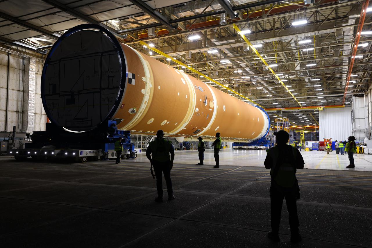 This photo shows NASA and Boeing, the SLS core stage lead contractor, preparing the SLS (Space Launch System) rocket core stage for shipment at NASA’s Michoud Assembly Facility in New Orleans. On July 6, NASA and Boeing moved the Artemis II rocket stage to Building 110. The move comes as teams prepare to roll the massive rocket stage with its four RS-25 engines to the agency’s Pegasus barge for delivery to NASA’s Kennedy Space Center in Florida in mid-July. Prior to the move, technicians began removing external access stands, or scaffolding, surrounding the core stage to assess the interior elements, including its complex avionics and flight propulsion systems. The stage is fully manufactured at NASA Michoud.  NASA is working to land the first woman, first person of color, and its first international partner astronaut on the Moon under Artemis. SLS is part of NASA’s backbone for deep space exploration, along with the Orion spacecraft, supporting ground systems, advanced spacesuits and rovers, the Gateway in orbit around the Moon, and commercial human landing systems. SLS is the only rocket that can send Orion, astronauts, and supplies to the Moon in a single launch.