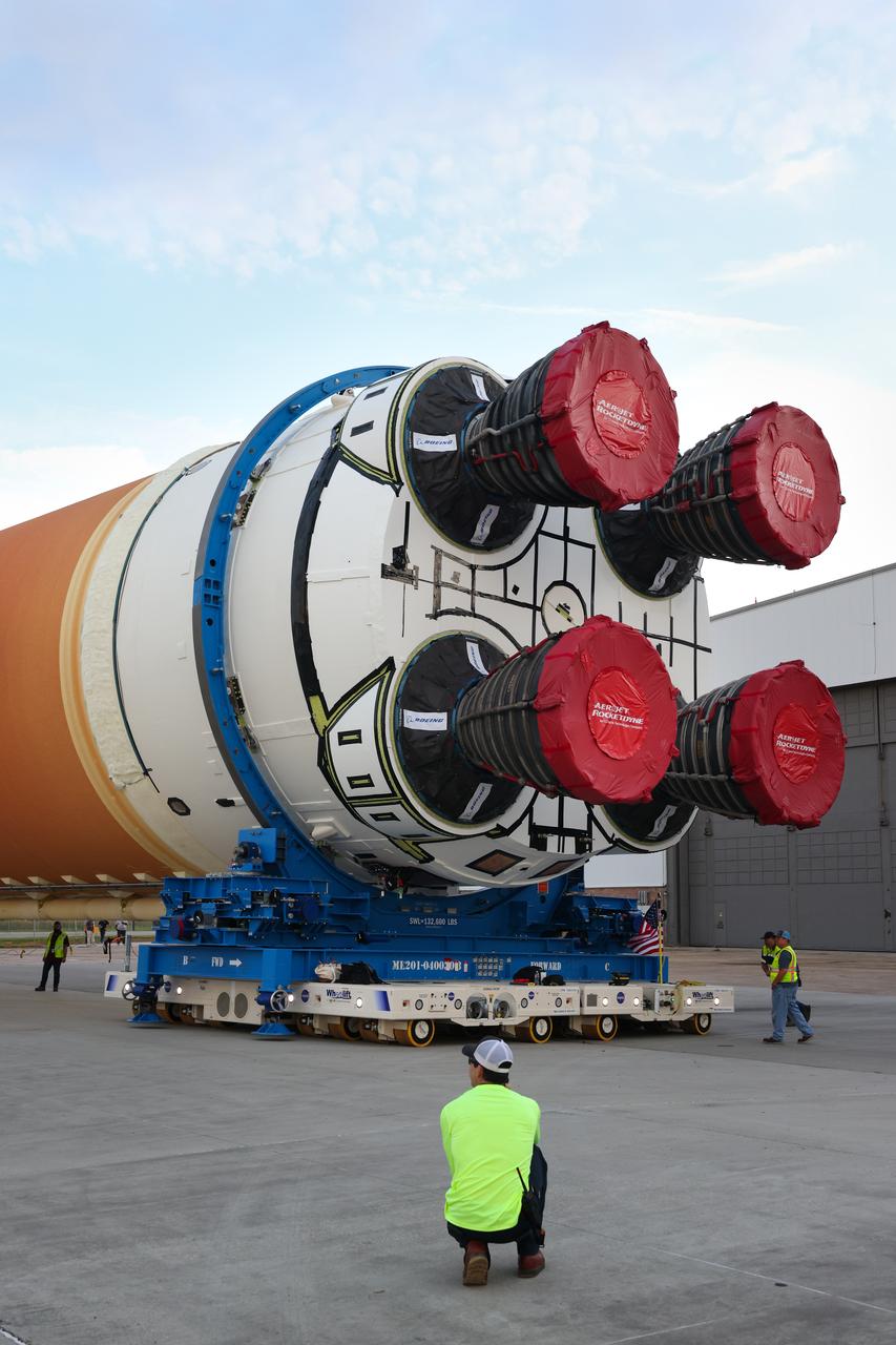 This photo shows NASA and Boeing, the SLS core stage lead contractor, preparing the SLS (Space Launch System) rocket core stage for shipment at NASA’s Michoud Assembly Facility in New Orleans. On July 6, NASA and Boeing moved the Artemis II rocket stage to Building 110. The move comes as teams prepare to roll the massive rocket stage with its four RS-25 engines to the agency’s Pegasus barge for delivery to NASA’s Kennedy Space Center in Florida in mid-July. Prior to the move, technicians began removing external access stands, or scaffolding, surrounding the core stage to assess the interior elements, including its complex avionics and flight propulsion systems. The stage is fully manufactured at NASA Michoud.  NASA is working to land the first woman, first person of color, and its first international partner astronaut on the Moon under Artemis. SLS is part of NASA’s backbone for deep space exploration, along with the Orion spacecraft, supporting ground systems, advanced spacesuits and rovers, the Gateway in orbit around the Moon, and commercial human landing systems. SLS is the only rocket that can send Orion, astronauts, and supplies to the Moon in a single launch.