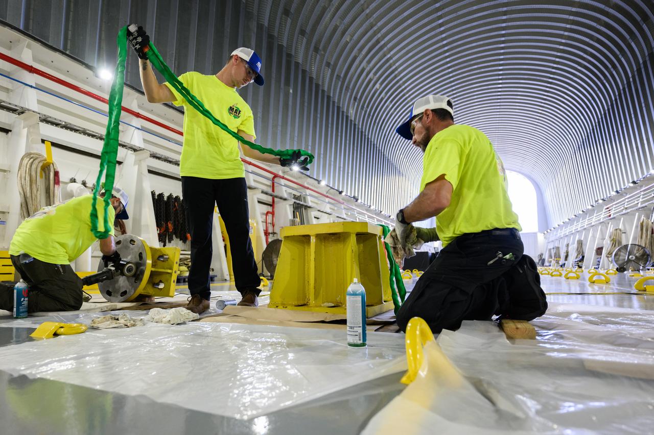 These photos show how team members installed pedestals aboard NASA’s Pegasus barge to hold and secure the massive core stage of NASA’s SLS (Space Launch System) rocket, indicating the barge and its crew are nearly ready for the barge’s first delivery to support the Artemis II test flight around the Moon. The barge will ferry the fully assembled core stage on a 900-mile journey from the agency’s Michoud Assembly Facility in New Orleans to its Kennedy Space Center in Florida. The Pegasus crew began installing the pedestals July 10. Pegasus is maintained at NASA Michoud. The SLS core stage is fully manufactured at Michoud.  NASA is working to land the first woman, first person of color, and its first international partner astronaut on the Moon under Artemis. SLS is part of NASA’s backbone for deep space exploration, along with the Orion spacecraft, supporting ground systems, advanced spacesuits and rovers, the Gateway in orbit around the Moon, and commercial human landing systems. SLS is the only rocket that can send Orion, astronauts, and supplies to the Moon in a single launch.  