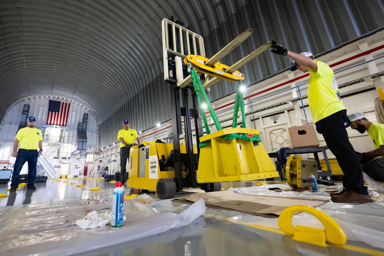 These photos show how team members installed pedestals aboard NASA’s Pegasus barge to hold and secure the massive core stage of NASA’s SLS (Space Launch System) rocket, indicating the barge and its crew are nearly ready for the barge’s first delivery to support the Artemis II test flight around the Moon. The barge will ferry the fully assembled core stage on a 900-mile journey from the agency’s Michoud Assembly Facility in New Orleans to its Kennedy Space Center in Florida. The Pegasus crew began installing the pedestals July 10. Pegasus is maintained at NASA Michoud. The SLS core stage is fully manufactured at Michoud.  NASA is working to land the first woman, first person of color, and its first international partner astronaut on the Moon under Artemis. SLS is part of NASA’s backbone for deep space exploration, along with the Orion spacecraft, supporting ground systems, advanced spacesuits and rovers, the Gateway in orbit around the Moon, and commercial human landing systems. SLS is the only rocket that can send Orion, astronauts, and supplies to the Moon in a single launch.  