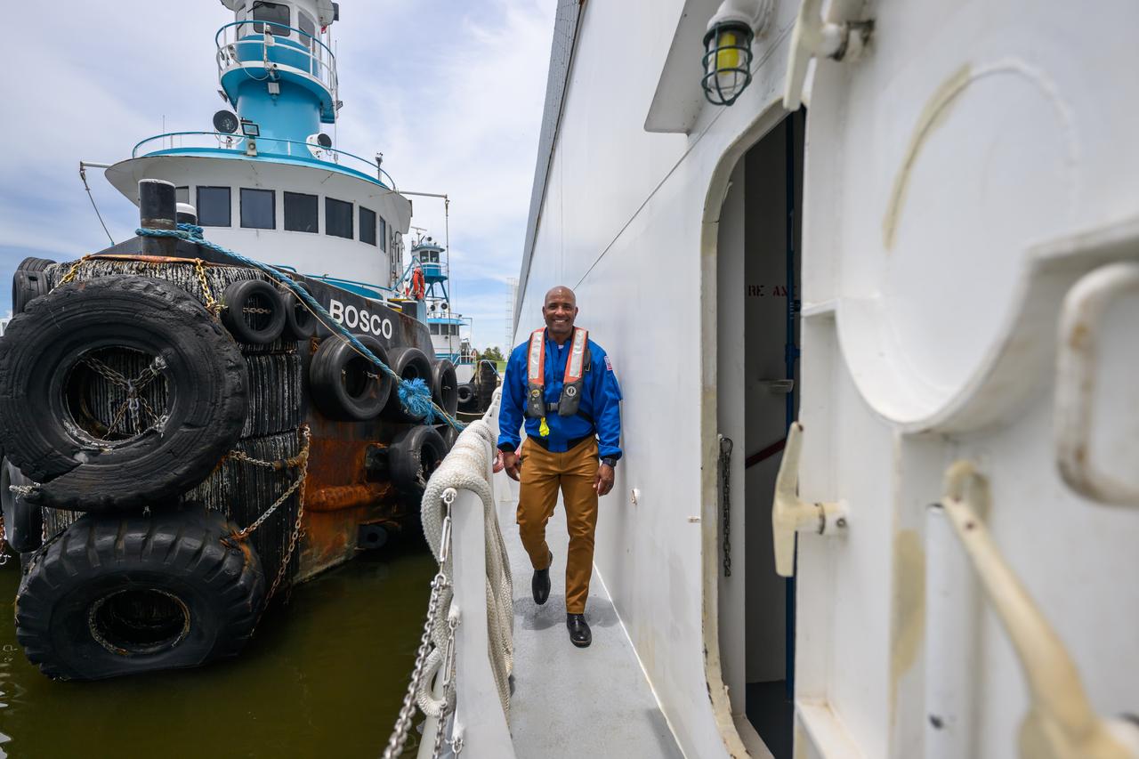 NASA astronaut Victor Glover views the core stage of the SLS (Space Launch System) rocket that will help power Artemis II at NASA’s Michoud Assembly Facility in New Orleans July 15. Glover will pilot Artemis II, the first crewed mission of NASA’s Artemis campaign. Crews moved the 212-foot-tall core stage with its four RS-25 engines to Building 110 at NASA Michoud prior to rolling it out to NASA’s Pegasus barge July 16 for delivery to NASA’s Kennedy Space Center in Florida. The core stage has two giant propellant tanks that collectively hold more than 733,000 gallons of super cold liquid propellant to feed the stage’s four RS-25 engines. Together, the engines produce more than 2 million pounds of thrust to help send astronauts inside NASA’s Orion spacecraft to venture around the Moon for Artemis II.  NASA is working to land the first woman, first person of color, and its first international partner astronaut on the Moon under Artemis. SLS is part of NASA’s backbone for deep space exploration, along with the Orion spacecraft, supporting ground systems, advanced spacesuits and rovers, the Gateway in orbit around the Moon, and commercial human landing systems. SLS is the only rocket that can send Orion, astronauts, and supplies to the Moon in a single launch.  