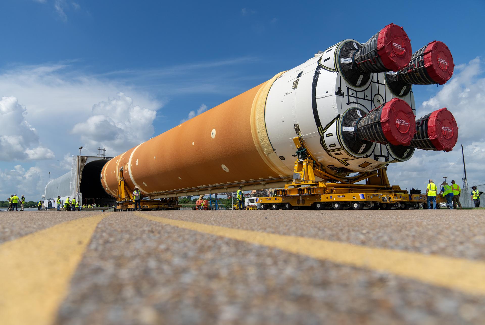 These images and videos show team members at Michoud Assembly Facility loading the first core stage that will help launch the first crewed flight of NASA's SLS (Space Launch System) rocket for the agency's Artemis II mission onto the Pegasus barge on Tuesday, July 16, 2024. The barge will ferry the core stage on a 900-mile journey from the agency's Michoud Assembly Facility in New Orleans to its Kennedy Space Center in Florida. The core stage for the SLS mega rocket is the largest stage NASA has ever produced. At 212 feet tall, the stage consists of five major elements, including two huge propellant tanks that collectively hold more than 733,000 gallons of super chilled liquid propellant to feed four RS-25 engines at its base. During launch and flight, the stage will operate for just over eight minutes, producing more than 2 million pounds of thrust to help send a crew of four astronauts inside NASA's Orion spacecraft onward to the Moon. All the major structures for every SLS core stage are fully manufactured at NASA Michoud. NASA is working to land the first woman, first person of color, and its first international partner astronaut on the Moon under Artemis. SLS is part of NASA's backbone for deep space exploration, along with the Orion spacecraft and Gateway in orbit around the Moon and commercial human landing systems, next-generation space, next-generational spacesuits, and rovers on the lunar surface. SLS is the only rocket that can send Orion, astronauts, and supplies to the Moon in a single launch.
