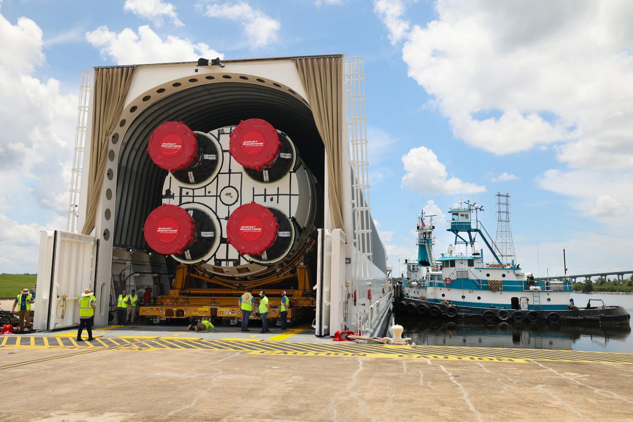 These images and videos show team members at Michoud Assembly Facility loading the first core stage that will help launch the first crewed flight of NASA’s SLS (Space Launch System) rocket for the agency’s Artemis II mission onto the Pegasus barge on Tuesday, July 16, 2024. The barge will ferry the core stage on a 900-mile journey from the agency’s Michoud Assembly Facility in New Orleans to its Kennedy Space Center in Florida. The core stage for the SLS mega rocket is the largest stage NASA has ever produced. At 212 feet tall, the stage consists of five major elements, including two huge propellant tanks that collectively hold more than 733,000 gallons of super chilled liquid propellant to feed four RS-25 engines at its base. During launch and flight, the stage will operate for just over eight minutes, producing more than 2 million pounds of thrust to help send a crew of four astronauts inside NASA’s Orion spacecraft onward to the Moon. All the major structures for every SLS core stage are fully manufactured at NASA Michoud.  NASA is working to land the first woman, first person of color, and its first international partner astronaut on the Moon under Artemis. SLS is part of NASA’s backbone for deep space exploration, along with the Orion spacecraft and Gateway in orbit around the Moon and commercial human landing systems, next-generation space, next-generational spacesuits, and rovers on the lunar surface. SLS is the only rocket that can send Orion, astronauts, and supplies to the Moon in a single launch.  