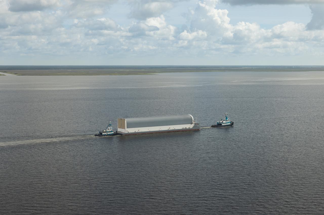NASA photographers Evan Deroche and Brandon Hancock joined the U.S. Coast Guard in an HH-60 Jayhawk helicopter to capture aerial views of NASA’s Pegasus barge just after it departed NASA’s Michoud Assembly Facility in New Orleans July 17 with the core stage of NASA’s SLS (Space Launch System) rocket for Artemis II. These photos and videos show the barge as it traveled down the Intracoastal Waterway to the Gulf of Mexico. Pegasus ferried the Artemis II core stage more than 900 miles to NASA’s Kennedy Space Center in Florida. It arrived with the flight hardware July 22. The barge is maintained at NASA’s Michoud Assembly Facility in New Orleans, where the core stage is fully manufactured.  NASA is working to land the first woman, first person of color, and its first international partner astronaut on the Moon under Artemis. SLS is part of NASA’s backbone for deep space exploration, along with the Orion spacecraft, supporting ground systems, advanced spacesuits and rovers, the Gateway in orbit around the Moon, and commercial human landing systems. SLS is the only rocket that can send Orion, astronauts, and supplies to the Moon in a single launch.