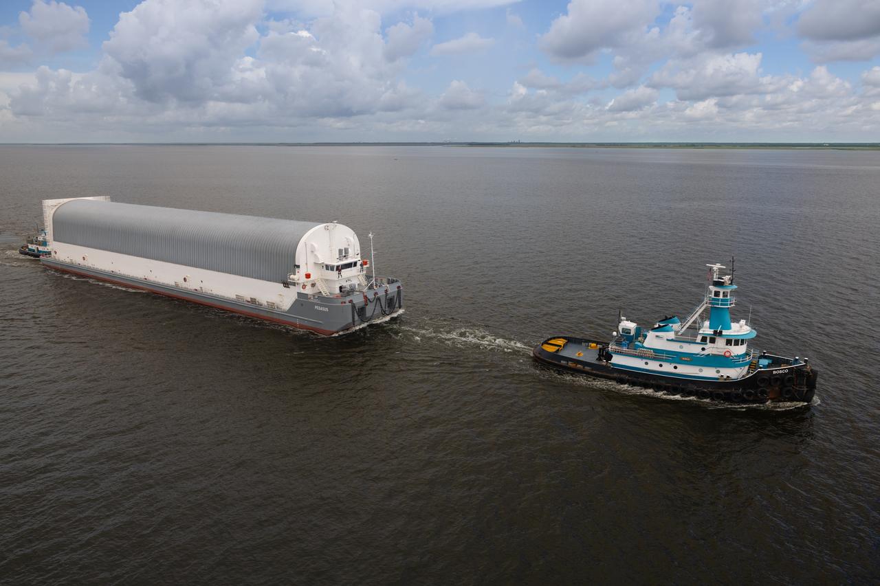 NASA photographers Evan Deroche and Brandon Hancock joined the U.S. Coast Guard in an HH-60 Jayhawk helicopter to capture aerial views of NASA’s Pegasus barge just after it departed NASA’s Michoud Assembly Facility in New Orleans July 17 with the core stage of NASA’s SLS (Space Launch System) rocket for Artemis II. These photos and videos show the barge as it traveled down the Intracoastal Waterway to the Gulf of Mexico. Pegasus ferried the Artemis II core stage more than 900 miles to NASA’s Kennedy Space Center in Florida. It arrived with the flight hardware July 22. The barge is maintained at NASA’s Michoud Assembly Facility in New Orleans, where the core stage is fully manufactured.  NASA is working to land the first woman, first person of color, and its first international partner astronaut on the Moon under Artemis. SLS is part of NASA’s backbone for deep space exploration, along with the Orion spacecraft, supporting ground systems, advanced spacesuits and rovers, the Gateway in orbit around the Moon, and commercial human landing systems. SLS is the only rocket that can send Orion, astronauts, and supplies to the Moon in a single launch.