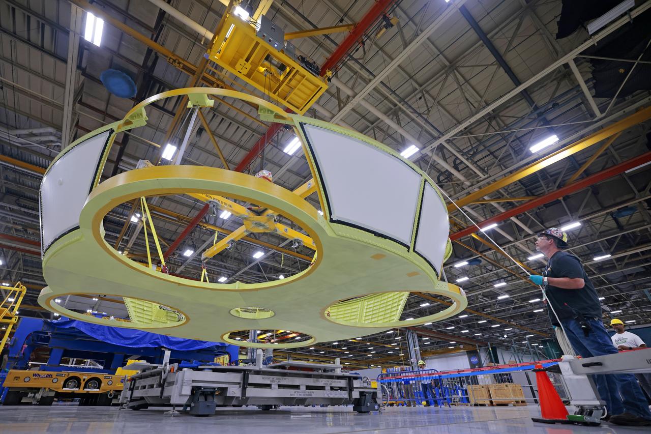 These photos show teams at NASA’s Michoud Assembly Facility in New Orleans preparing, moving, and loading the engine section boat-tail of NASA’s SLS (Space Launch System) rocket for the Artemis III mission for transportation to NASA’s Kennedy Space Center in Florida via the agency’s Pegasus barge. Inside the factory on Aug. 14 prior to the move, technicians covered the spaceflight hardware with a tarp to help protect it on its journey aboard NASA’s Pegasus barge. Crews then rolled out the hardware on Aug. 27 from the factory floor to the barge. Once in Florida, the boat-tail will be integrated with the engine section -- also manufactured at Michoud -- inside Kennedy’s Space Station Processing Facility. The engine section arrived at NASA Kennedy in Dec. 2022. Located at the bottom of the engine section, the aerodynamic boat-tail fairing channels airflow and protects the stage’s four RS-25 engines from extreme temperatures during launch. The engine section is one of five major elements that make up the 212-foot-tall rocket stage. The core stage, along with its four RS-25 engines, produce two million pounds of thrust to help launch NASA’s Orion spacecraft, astronauts, and supplies beyond Earth’s orbit and to the lunar surface for Artemis. Image credit: NASA/Michael DeMocker
