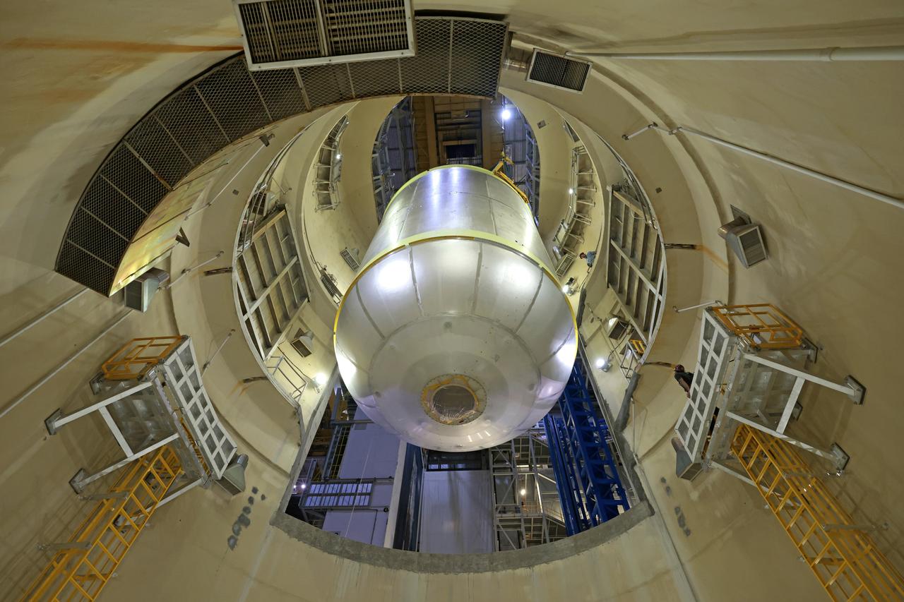 Teams at NASA’s Michoud Assembly Facility in New Orleans move a liquid oxygen tank for its SLS (Space Launch System) rocket to a cleaning cell inside the facility’s vertical assembly building on Oct. 11. The tank, which will be used on the core stage of the agency’s Artemis III mission, will undergo an internal cleaning before moving on to its next phase of production. Inside the cleaning cell, a solution is sprayed into the tank to remove particulates which may collect during the manufacturing process. Once a tank is cleaned, teams use mobile clean rooms for internal access to the tank to prevent external contaminates from entering the hardware. The propellant tank is one of five major elements that make up the 212-foot-tall rocket stage. The core stage, along with its four RS-25 engines, produce more than two million pounds of thrust to help launch NASA’s Orion spacecraft, astronauts, and supplies beyond Earth’s orbit and to the lunar surface for Artemis. Image credit: NASA/Michael DeMocker
