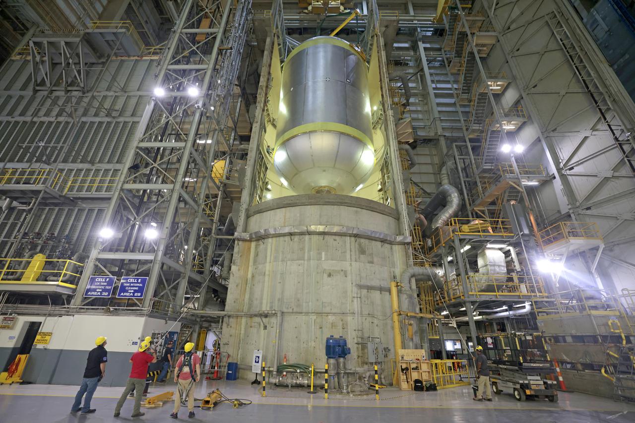 Teams at NASA’s Michoud Assembly Facility in New Orleans move a liquid oxygen tank for its SLS (Space Launch System) rocket to a cleaning cell inside the facility’s vertical assembly building on Oct. 11. The tank, which will be used on the core stage of the agency’s Artemis III mission, will undergo an internal cleaning before moving on to its next phase of production. Inside the cleaning cell, a solution is sprayed into the tank to remove particulates which may collect during the manufacturing process. Once a tank is cleaned, teams use mobile clean rooms for internal access to the tank to prevent external contaminates from entering the hardware. The propellant tank is one of five major elements that make up the 212-foot-tall rocket stage. The core stage, along with its four RS-25 engines, produce more than two million pounds of thrust to help launch NASA’s Orion spacecraft, astronauts, and supplies beyond Earth’s orbit and to the lunar surface for Artemis. Image credit: NASA/Michael DeMocker