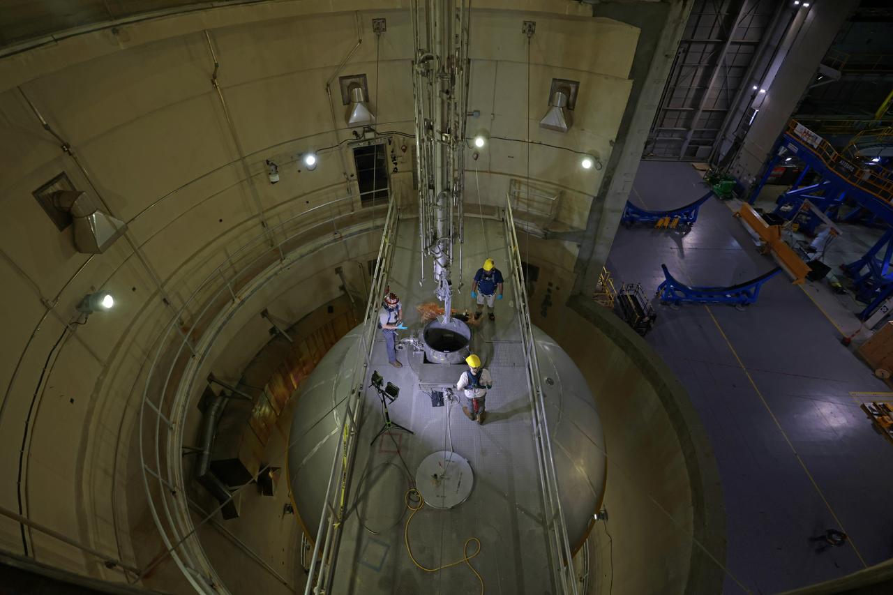 Teams at NASA’s Michoud Assembly Facility in New Orleans install wash probes into a liquid oxygen tank inside the factory’s cleaning cell on Oct. 25. The tank, which will be used on the core stage of the agency’s SLS (Space Launch System) rocket for its Artemis III mission, will undergo an internal cleaning before moving on to its next phase of production. Inside the cleaning cell, a solution is sprayed into the tank to remove particulates which may collect during the manufacturing process. Once a tank is cleaned, teams use mobile clean rooms for internal access to the tank to prevent external contaminates from entering the hardware. The propellant tank is one of five major elements that make up the 212-foot-tall rocket stage. The core stage, along with its four RS-25 engines, produce more than two million pounds of thrust to help launch NASA’s Orion spacecraft, astronauts, and supplies beyond Earth’s orbit and to the lunar surface for Artemis.  Image credit: NASA/Michael DeMocker