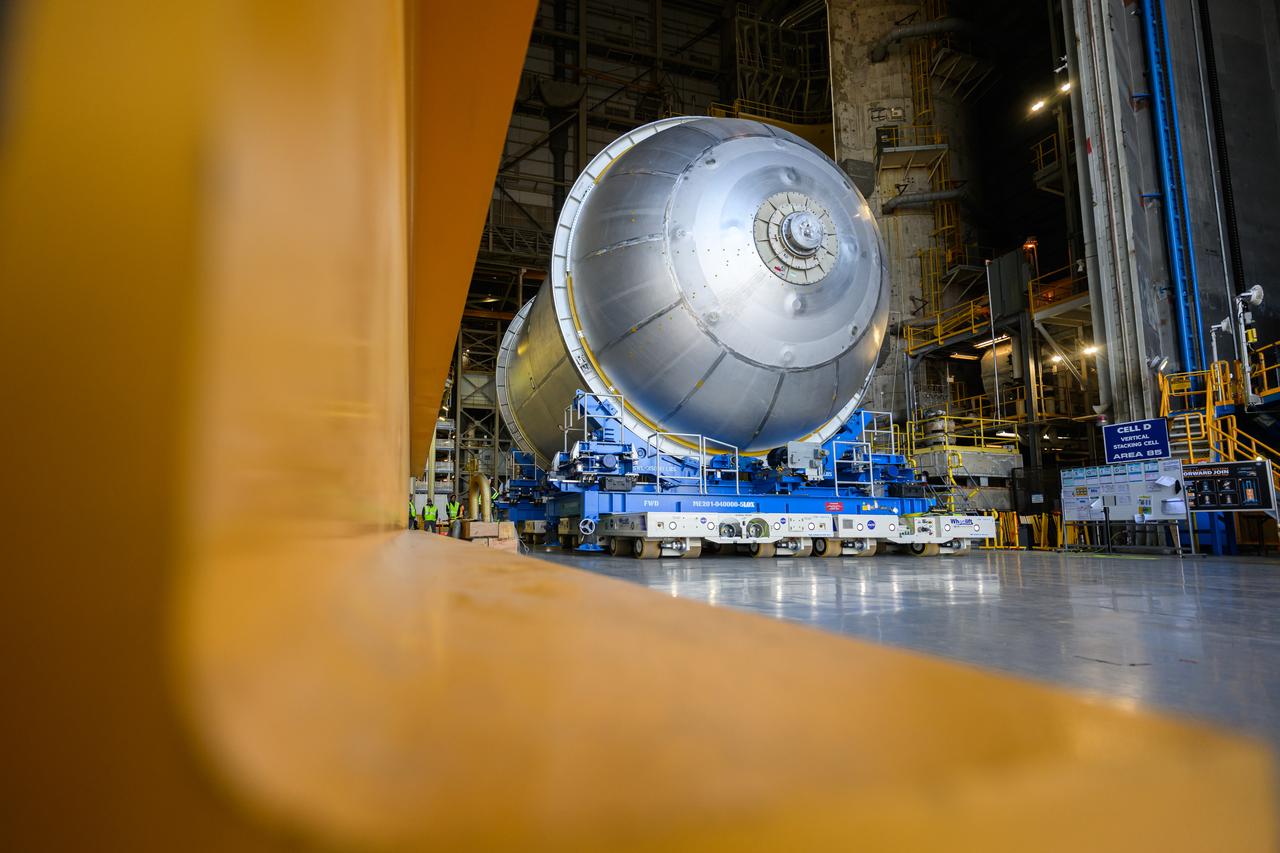 Move crews at NASA’s Michoud Assembly Facility in New Orleans  move a liquid oxygen tank for its SLS (Space Launch System) rocket from the vertical assembly building into a nearby cell on Dec. 23. The tank, which will be used on the core stage of the agency’s Artemis III mission, will be primed using an automated process in preparation for application of its thermal protection system.   The propellant tank is one of five major elements that make up the 212-foot-tall rocket stage. The core stage, along with its four RS-25 engines, produce more than two million pounds of thrust to help launch NASA’s Orion spacecraft, astronauts, and supplies beyond Earth’s orbit and to the lunar surface for Artemis.