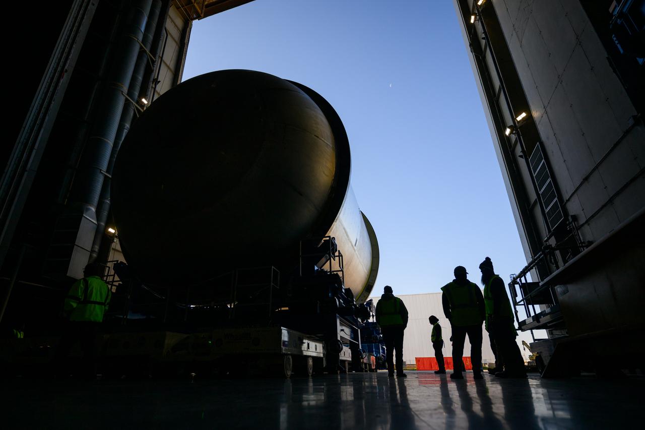 Move crews at NASA’s Michoud Assembly Facility in New Orleans  move a liquid oxygen tank for its SLS (Space Launch System) rocket from the vertical assembly building into a nearby cell on Dec. 23. The tank, which will be used on the core stage of the agency’s Artemis III mission, will be primed using an automated process in preparation for application of its thermal protection system.   The propellant tank is one of five major elements that make up the 212-foot-tall rocket stage. The core stage, along with its four RS-25 engines, produce more than two million pounds of thrust to help launch NASA’s Orion spacecraft, astronauts, and supplies beyond Earth’s orbit and to the lunar surface for Artemis.