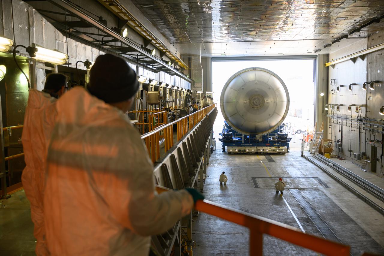 Move crews at NASA’s Michoud Assembly Facility in New Orleans  move a liquid oxygen tank for its SLS (Space Launch System) rocket from the vertical assembly building into a nearby cell on Dec. 23. The tank, which will be used on the core stage of the agency’s Artemis III mission, will be primed using an automated process in preparation for application of its thermal protection system.   The propellant tank is one of five major elements that make up the 212-foot-tall rocket stage. The core stage, along with its four RS-25 engines, produce more than two million pounds of thrust to help launch NASA’s Orion spacecraft, astronauts, and supplies beyond Earth’s orbit and to the lunar surface for Artemis.