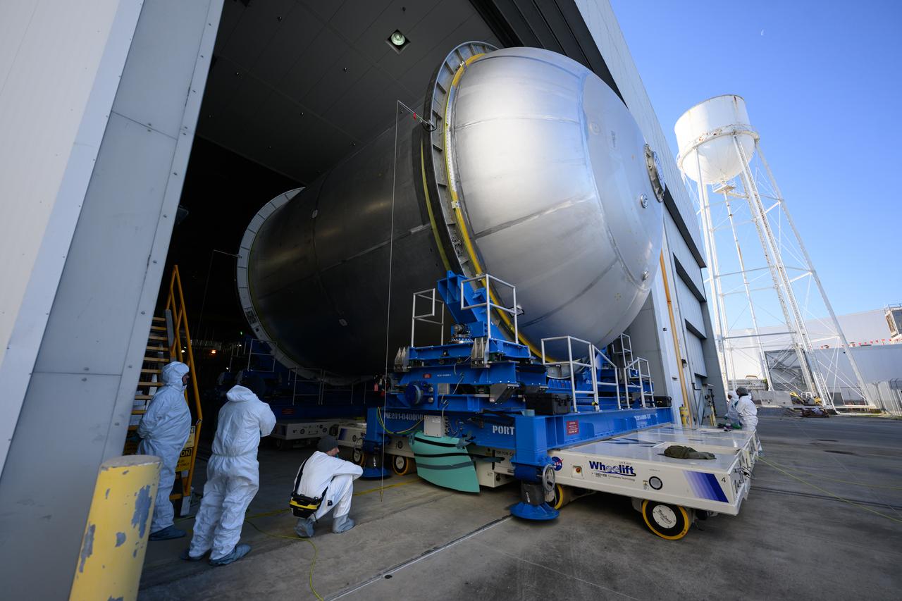 Move crews at NASA’s Michoud Assembly Facility in New Orleans  move a liquid oxygen tank for its SLS (Space Launch System) rocket from the vertical assembly building into a nearby cell on Dec. 23. The tank, which will be used on the core stage of the agency’s Artemis III mission, will be primed using an automated process in preparation for application of its thermal protection system.   The propellant tank is one of five major elements that make up the 212-foot-tall rocket stage. The core stage, along with its four RS-25 engines, produce more than two million pounds of thrust to help launch NASA’s Orion spacecraft, astronauts, and supplies beyond Earth’s orbit and to the lunar surface for Artemis.