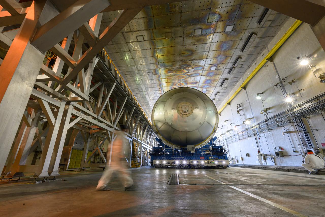 Move crews at NASA’s Michoud Assembly Facility in New Orleans  move a liquid oxygen tank for its SLS (Space Launch System) rocket from the vertical assembly building into a nearby cell on Dec. 23. The tank, which will be used on the core stage of the agency’s Artemis III mission, will be primed using an automated process in preparation for application of its thermal protection system.   The propellant tank is one of five major elements that make up the 212-foot-tall rocket stage. The core stage, along with its four RS-25 engines, produce more than two million pounds of thrust to help launch NASA’s Orion spacecraft, astronauts, and supplies beyond Earth’s orbit and to the lunar surface for Artemis.