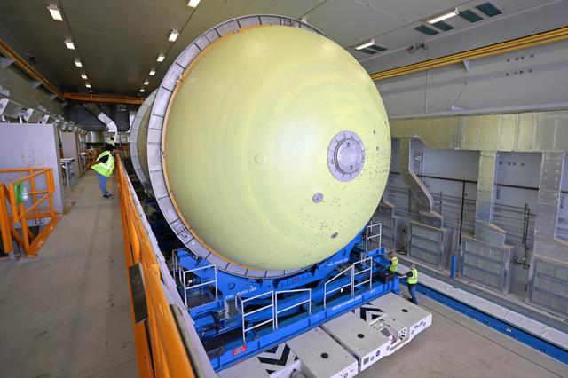 NASA image: Artemis III Liquid Oxygen Tank Moves to Thermal Protection System Application Cell 