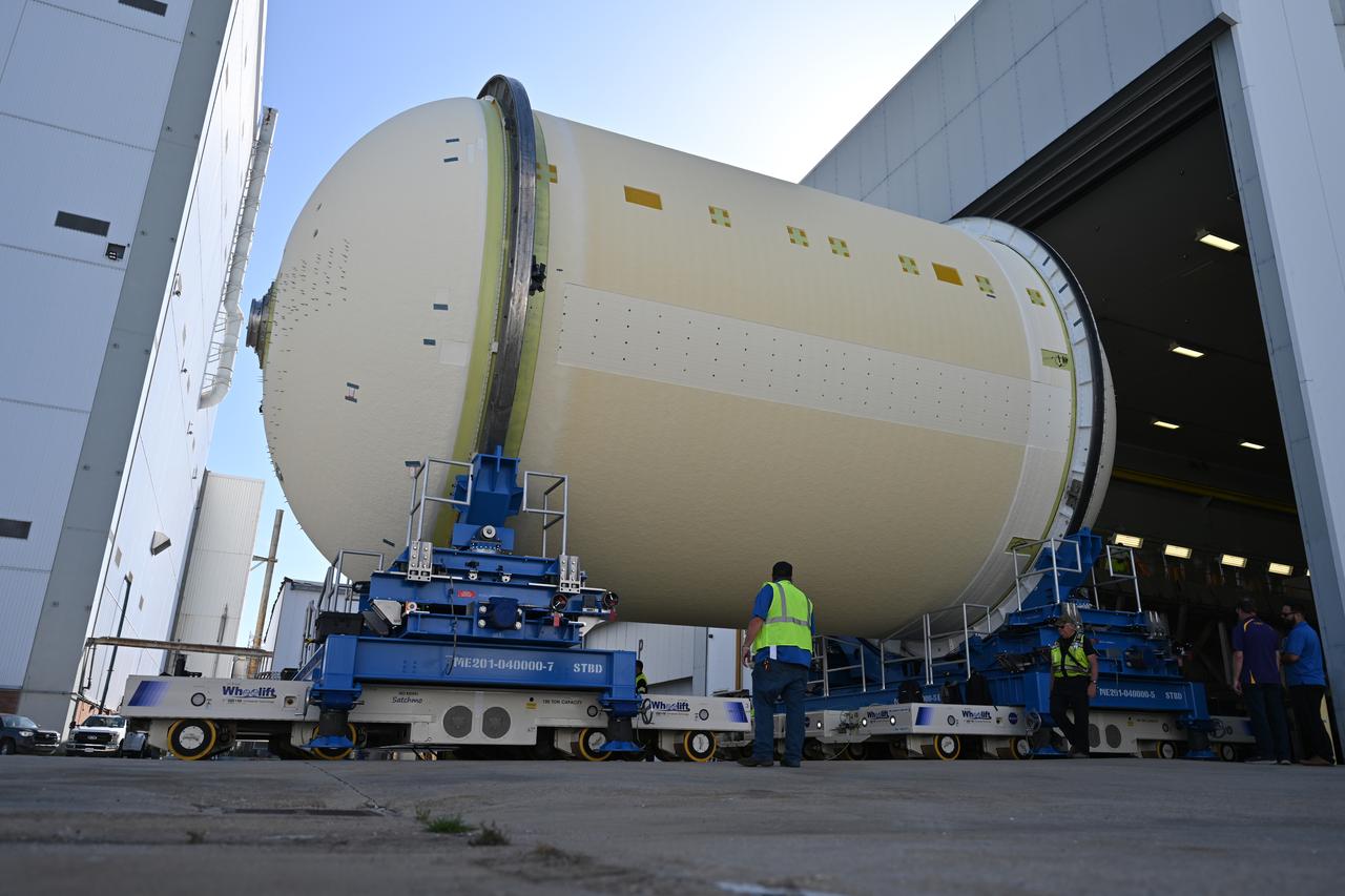Teams move a liquid oxygen tank – designated for the core stage of NASA’s SLS (Space Launch System) rocket for its Artemis III mission – from the thermal protection system application cell at NASA’s Michoud Assembly Facility in New Orleans to the site’s 210-foot-tall Vertical Assembly Building on July 9. Next, NASA’s SLS prime contractor, Boeing, will vertically install the tank’s aft sump subassembly.  The propellant tank is one of five major elements that make up the 212-foot-tall rocket stage. The core stage, along with its four RS-25 engines, produce more than two million pounds of thrust to help launch NASA’s Orion spacecraft, astronauts, and supplies beyond Earth’s orbit and to the lunar surface for Artemis. 
