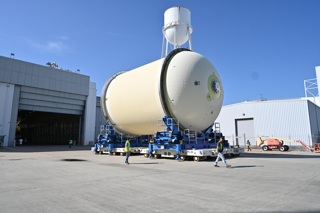 Teams move a liquid oxygen tank – designated for the core stage of NASA’s SLS (Space Launch System) rocket for its Artemis III mission – from the thermal protection system application cell at NASA’s Michoud Assembly Facility in New Orleans to the site’s 210-foot-tall Vertical Assembly Building on July 9. Next, NASA’s SLS prime contractor, Boeing, will vertically install the tank’s aft sump subassembly.  The propellant tank is one of five major elements that make up the 212-foot-tall rocket stage. The core stage, along with its four RS-25 engines, produce more than two million pounds of thrust to help launch NASA’s Orion spacecraft, astronauts, and supplies beyond Earth’s orbit and to the lunar surface for Artemis. 