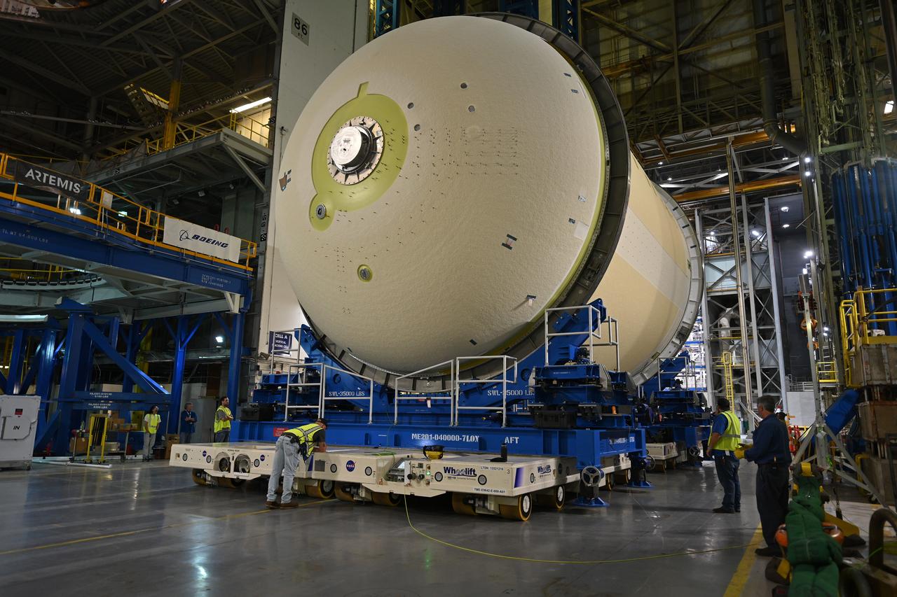 Teams move a liquid oxygen tank – designated for the core stage of NASA’s SLS (Space Launch System) rocket for its Artemis III mission – from the thermal protection system application cell at NASA’s Michoud Assembly Facility in New Orleans to the site’s 210-foot-tall Vertical Assembly Building on July 9. Next, NASA’s SLS prime contractor, Boeing, will vertically install the tank’s aft sump subassembly.  The propellant tank is one of five major elements that make up the 212-foot-tall rocket stage. The core stage, along with its four RS-25 engines, produce more than two million pounds of thrust to help launch NASA’s Orion spacecraft, astronauts, and supplies beyond Earth’s orbit and to the lunar surface for Artemis. 