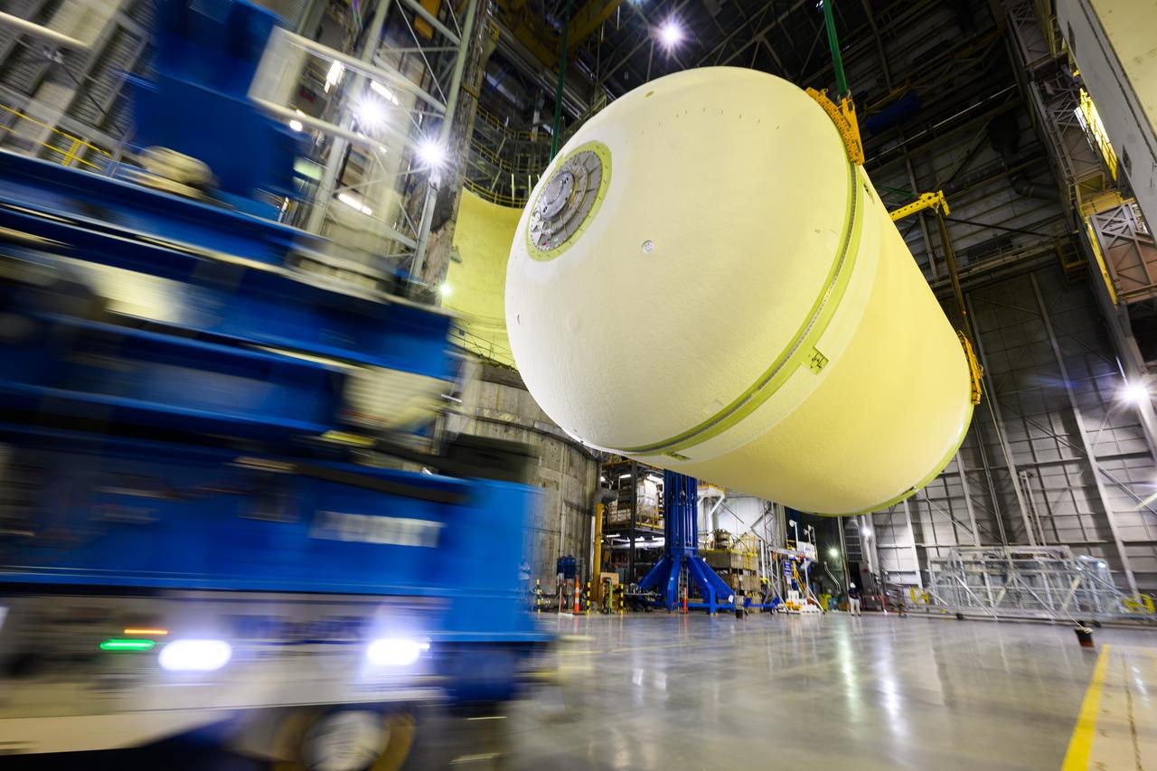 Teams at NASA’s Michoud Assembly Facility in New Orleans lift a liquid oxygen tank from a horizontal to a vertical position and place it into a production cell on July 12. The process, called a breakover, will allow technicians to rappel into the empty tank and install its aft sump subassembly, securing it from the inside. This tank will be used on the core stage of NASA’s SLS (Space Launch System) rocket for its Artemis III mission. The propellant tank is one of five major elements that make up the 212-foot-tall rocket stage. The core stage, along with its four RS-25 engines, produce more than two million pounds of thrust to help launch NASA’s Orion spacecraft, astronauts, and supplies beyond Earth’s orbit and to the lunar surface for Artemis. 