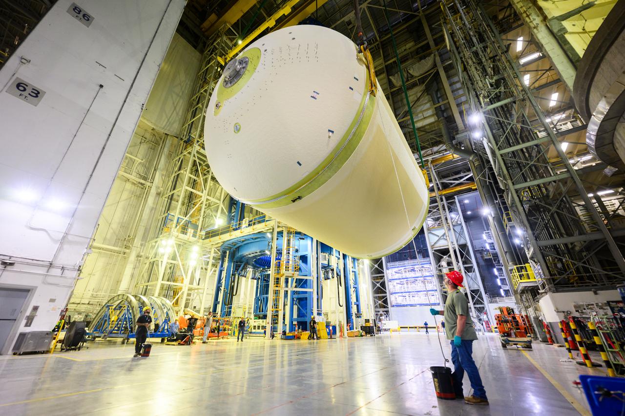 Teams at NASA’s Michoud Assembly Facility in New Orleans lift a liquid oxygen tank from a horizontal to a vertical position and place it into a production cell on July 12. The process, called a breakover, will allow technicians to rappel into the empty tank and install its aft sump subassembly, securing it from the inside. This tank will be used on the core stage of NASA’s SLS (Space Launch System) rocket for its Artemis III mission. The propellant tank is one of five major elements that make up the 212-foot-tall rocket stage. The core stage, along with its four RS-25 engines, produce more than two million pounds of thrust to help launch NASA’s Orion spacecraft, astronauts, and supplies beyond Earth’s orbit and to the lunar surface for Artemis. 
