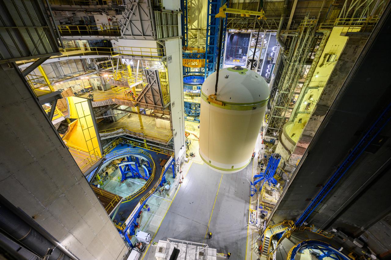 Teams at NASA’s Michoud Assembly Facility in New Orleans lift a liquid oxygen tank from a horizontal to a vertical position and place it into a production cell on July 12. The process, called a breakover, will allow technicians to rappel into the empty tank and install its aft sump subassembly, securing it from the inside. This tank will be used on the core stage of NASA’s SLS (Space Launch System) rocket for its Artemis III mission. The propellant tank is one of five major elements that make up the 212-foot-tall rocket stage. The core stage, along with its four RS-25 engines, produce more than two million pounds of thrust to help launch NASA’s Orion spacecraft, astronauts, and supplies beyond Earth’s orbit and to the lunar surface for Artemis. 