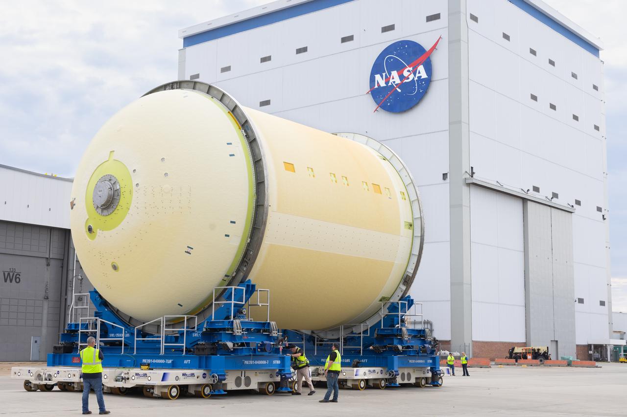 Move crews at NASA’s Michoud Assembly Facility in New Orleans move a liquid oxygen tank out of the facility’s vertical assembly building on Aug. 27, 2025. Using self-propelled mobile transporters teams transferred the tank to the final assembly production area. There, it will undergo integration of the forward dome by SLS (Space Launch System) prime contractor, Boeing. Eventually, the liquid oxygen tank will be moved back to the high bay where it will be mated with the intertank and forward skirt to complete the forward join of the Artemis III core stage. The propellant tank is one of five major elements that make up the 212-foot-tall rocket stage. The core stage, along with its four RS-25 engines, produce more than two million pounds of thrust to help launch NASA’s Orion spacecraft, astronauts, and supplies beyond Earth’s orbit and to the lunar surface for Artemis.