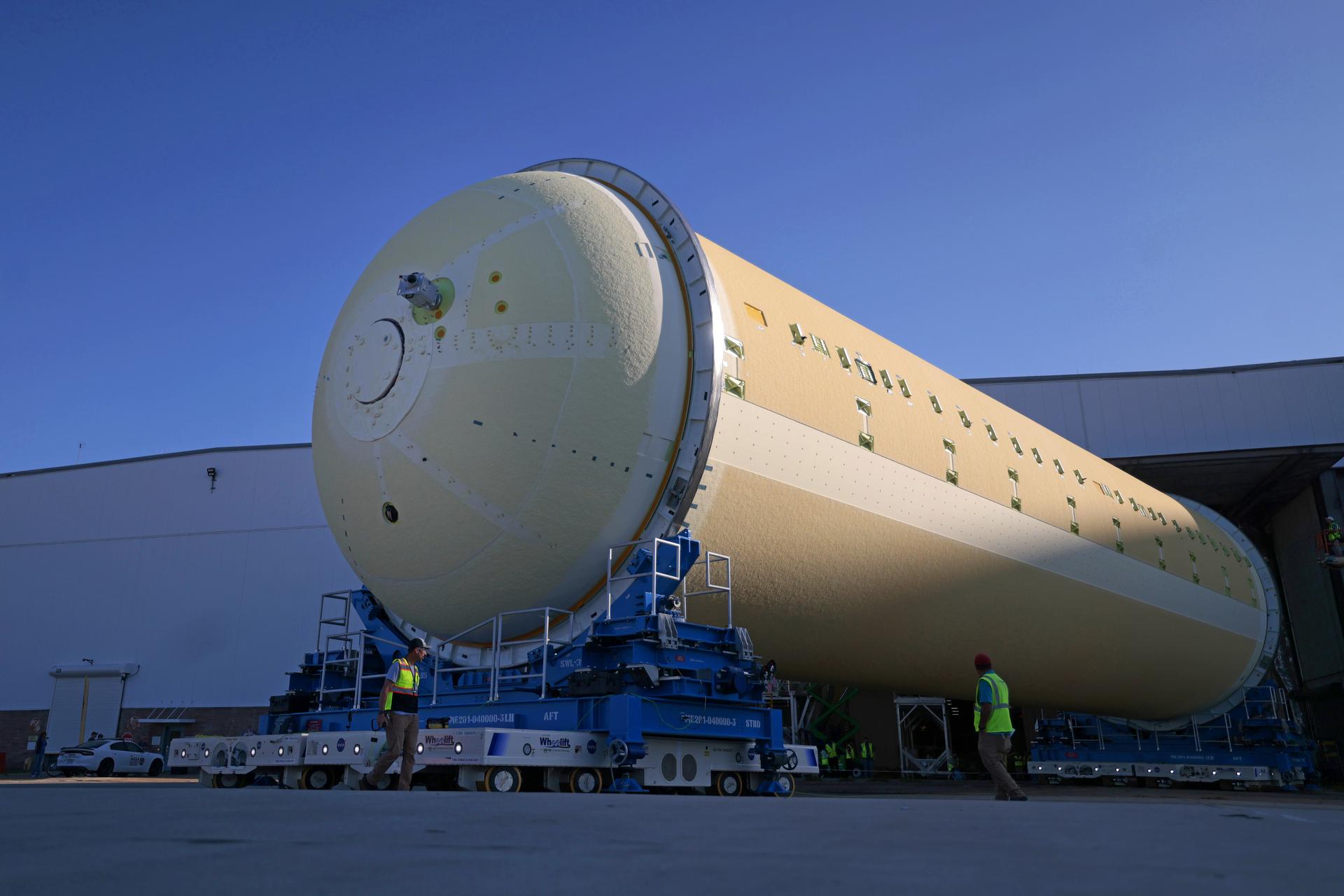 Teams at NASA’s Michoud Assembly Facility in New Orleans move a liquid hydrogen tank for the agency’s SLS (Space Launch System) rocket into the factory’s vertical assembly building on Sep. 26, 2025. The tank, which is designated for the agency’s Artemis III mission, is lifted and loaded into a production cell where it will be mated with the LH2 Transport Adapter Assembly for future transportation to NASA’s Kennedy Space Center. The engine section flight hardware structure was completed in 2022 and was shipped to Kennedy where teams continue to integrate vital systems. The propellant tank is one of five major elements that make up the 212-foot-tall rocket stage. The core stage, along with its four RS-25 engines, produce more than two million pounds of thrust to help launch NASA’s Orion spacecraft, astronauts, and supplies beyond Earth’s orbit and to the lunar surface for Artemis. Image credit: NASA/Michael DeMocker