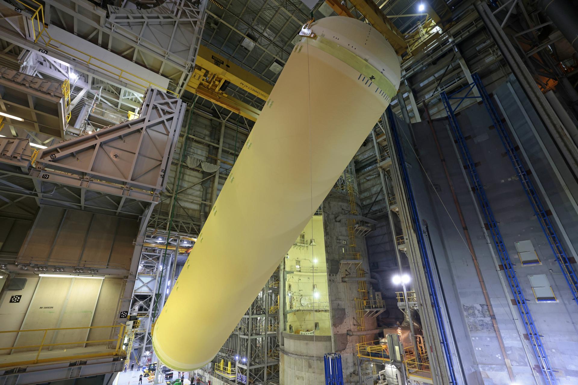 Teams at NASA’s Michoud Assembly Facility in New Orleans move a liquid hydrogen tank for the agency’s SLS (Space Launch System) rocket inside the factory’s vertical assembly building on Sep. 28, 2025. The tank, which is designated for the agency’s Artemis III mission, is being lifted and loaded into a production cell where it will be mated with the LH2 Transport Adapter Assembly for future transportation to NASA’s Kennedy Space Center. The engine section flight hardware structure was completed in 2022 and was shipped to Kennedy where teams continue to integrate vital systems.  The propellant tank is one of five major elements that make up the 212-foot-tall rocket stage. The core stage, along with its four RS-25 engines, produce more than two million pounds of thrust to help launch NASA’s Orion spacecraft, astronauts, and supplies beyond Earth’s orbit and to the lunar surface for Artemis.     Image credit: NASA/Michael DeMocker