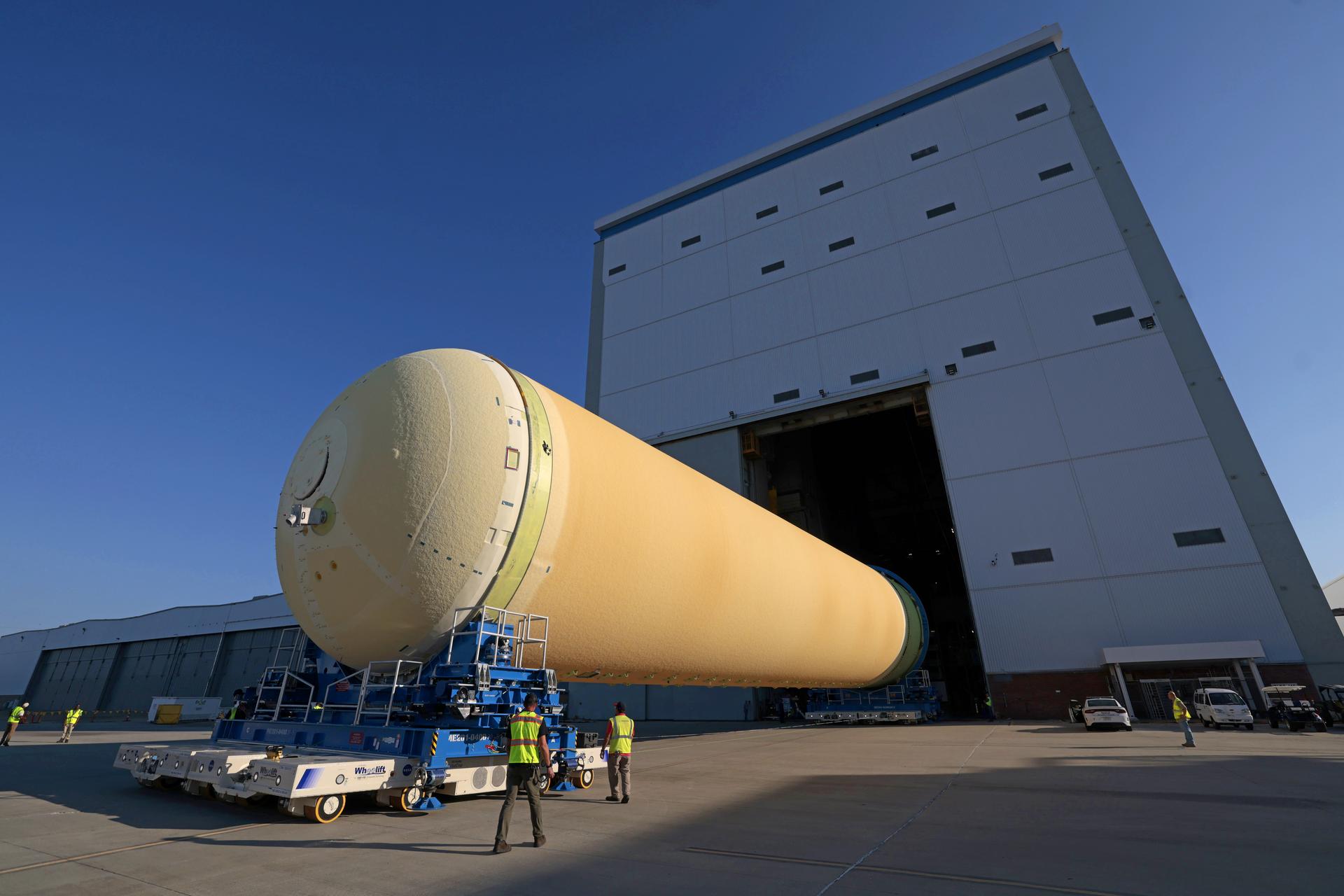 NASA’s Michoud Assembly move crews lift the liquid hydrogen tank for its Artemis III mission out of a production cell and move it into the final assembly manufacturing area on Oct. 10, 2025. Teams with SLS (Space Launch System) prime contractor, Boeing, recently mated the tank to the LH2 Transport Adapter Assembly, which will allow the stage to be securely transported by barge to NASA’s Kennedy Space Center once it’s mated to the forward end of the core stage. The LH2 Transport Adapter Assembly serves as a temporary place holder for the engine section, which was previously shipped from Michoud to NASA’s Kennedy Space Center for further integration.  The propellant tank is one of five major elements that make up the 212-foot-tall rocket stage. The core stage, along with its four RS-25 engines, produce more than two million pounds of thrust to help launch NASA’s Orion spacecraft, astronauts, and supplies beyond Earth’s orbit and to the lunar surface for Artemis.    Image credit: NASA/Michael DeMocker