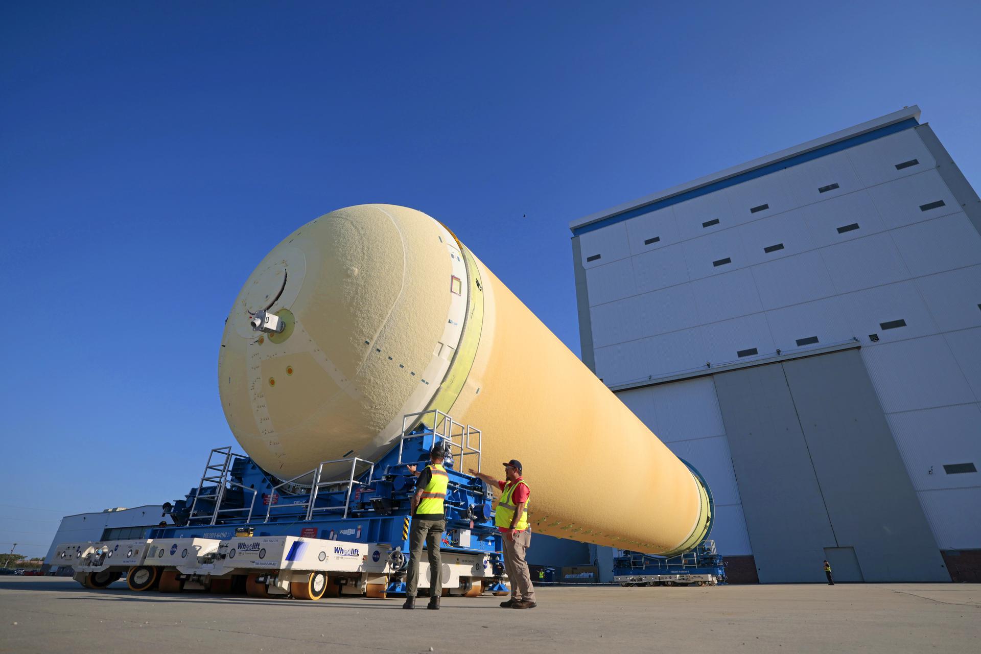 NASA’s Michoud Assembly move crews lift the liquid hydrogen tank for its Artemis III mission out of a production cell and move it into the final assembly manufacturing area on Oct. 10, 2025. Teams with SLS (Space Launch System) prime contractor, Boeing, recently mated the tank to the LH2 Transport Adapter Assembly, which will allow the stage to be securely transported by barge to NASA’s Kennedy Space Center once it’s mated to the forward end of the core stage. The LH2 Transport Adapter Assembly serves as a temporary place holder for the engine section, which was previously shipped from Michoud to NASA’s Kennedy Space Center for further integration.  The propellant tank is one of five major elements that make up the 212-foot-tall rocket stage. The core stage, along with its four RS-25 engines, produce more than two million pounds of thrust to help launch NASA’s Orion spacecraft, astronauts, and supplies beyond Earth’s orbit and to the lunar surface for Artemis.    Image credit: NASA/Michael DeMocker