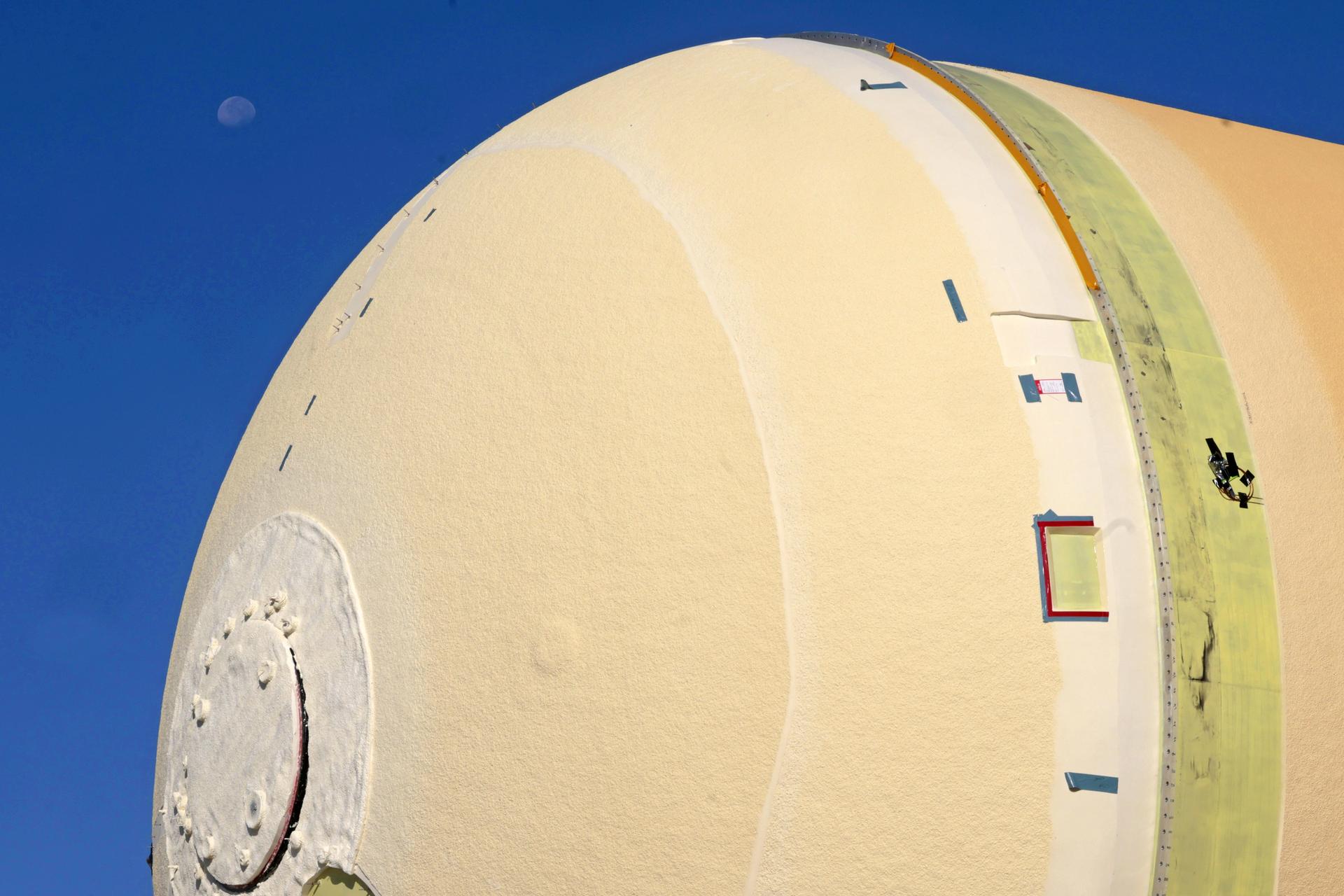 NASA’s Michoud Assembly move crews lift the liquid hydrogen tank for its Artemis III mission out of a production cell and move it into the final assembly manufacturing area on Oct. 10, 2025. Teams with SLS (Space Launch System) prime contractor, Boeing, recently mated the tank to the LH2 Transport Adapter Assembly, which will allow the stage to be securely transported by barge to NASA’s Kennedy Space Center once it’s mated to the forward end of the core stage. The LH2 Transport Adapter Assembly serves as a temporary place holder for the engine section, which was previously shipped from Michoud to NASA’s Kennedy Space Center for further integration.  The propellant tank is one of five major elements that make up the 212-foot-tall rocket stage. The core stage, along with its four RS-25 engines, produce more than two million pounds of thrust to help launch NASA’s Orion spacecraft, astronauts, and supplies beyond Earth’s orbit and to the lunar surface for Artemis.    Image credit: NASA/Michael DeMocker